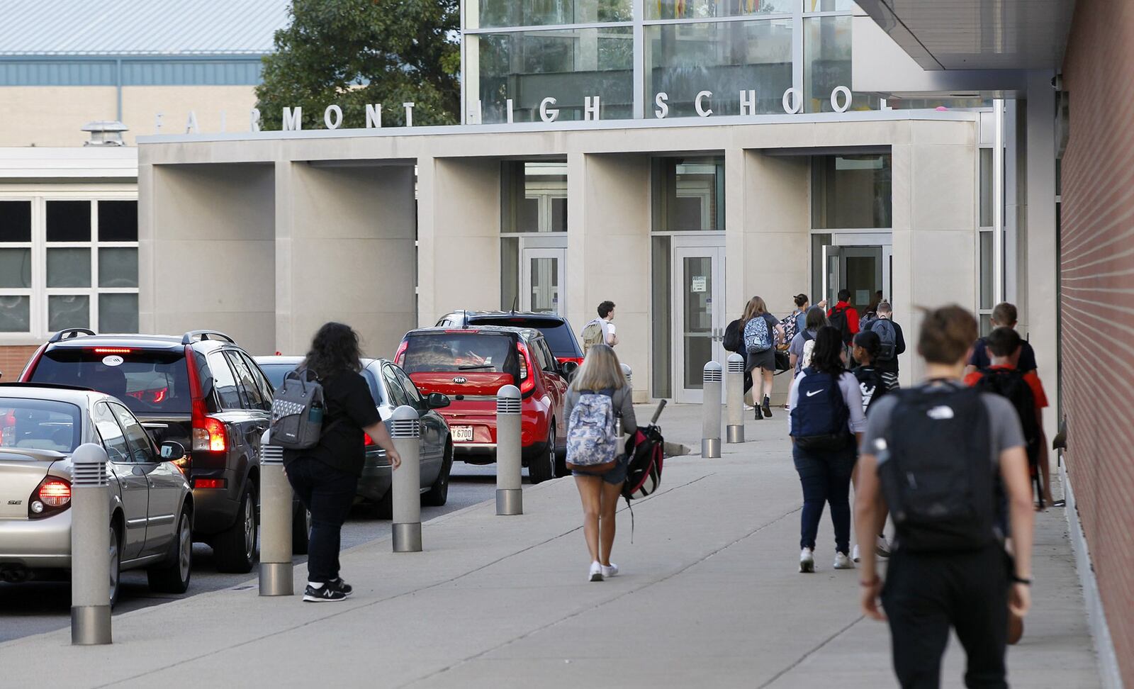 Students enter Kettering Fairmont High School on a fall morning. TY GREENLEES / STAFF