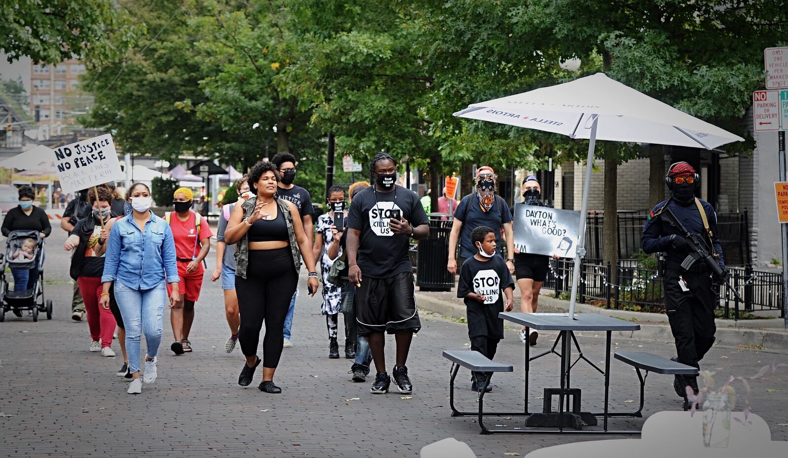 About 20 people demonstrated in support of the Black Lives Matter movement in the Oregon District on Saturday. 