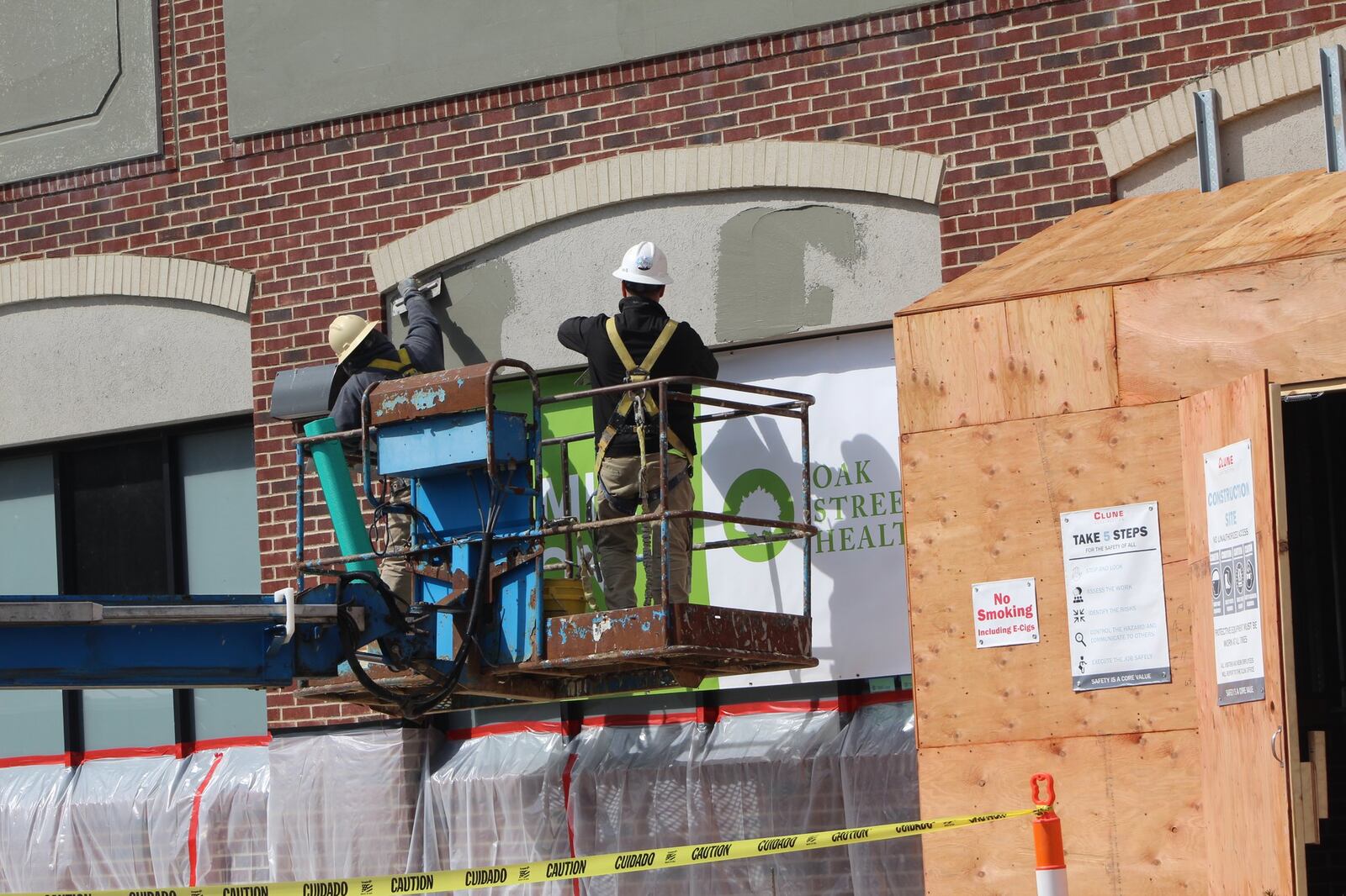 Construction crews worked on the outside of the former Dollar General store building at 1431 Wayne Ave. The space is being turned into a new Oak Street Health location. CORNELIUS FROLIK / STAFF