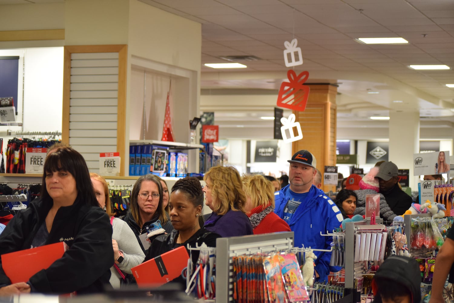 PHOTOS: Hundreds like up outside JCPenney for doorbusters, coupons