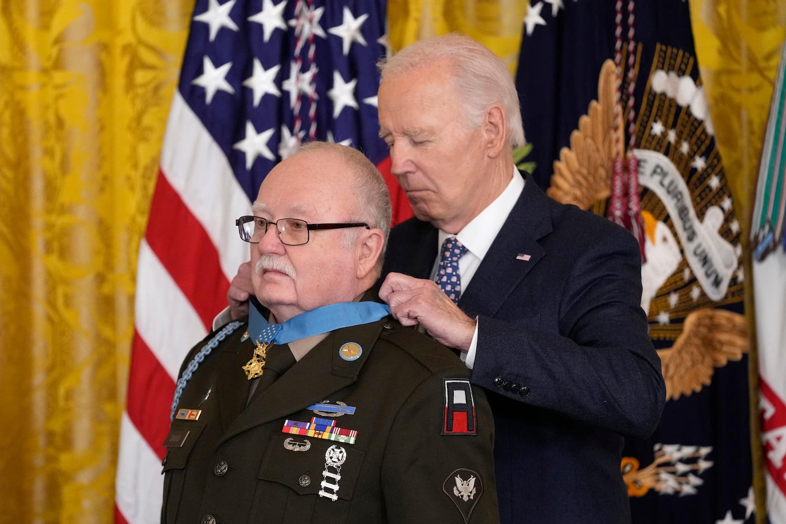 President Joe Biden presents the Medal of Honor, the nation's highest military decoration, to then-Private First Class Kenneth J. David, during a ceremony in the East Room of the White House in Washington, Friday, Jan. 3, 2025. (AP Photo/Susan Walsh)