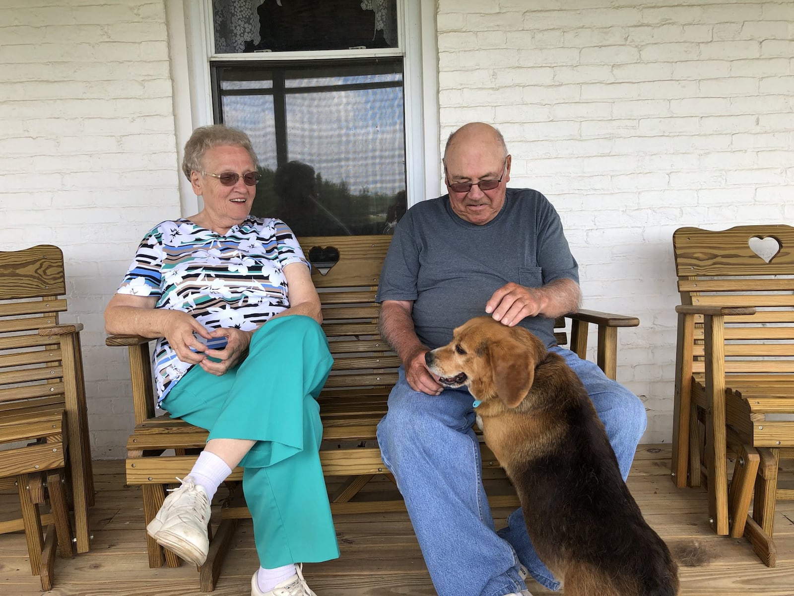 James and Mary Ann Barr and their dog, Otis, after last Monday’s tornado ripped off the roof of their home at 1045 Ludlow Road in Beavercreek Township. Their farm was also hit by a tornado on April 3, 2018. The latest tornado tore off their home’s roof, which they had had replaced after last year’s tornado, and damaged two other buildings, including one that was replaced after being damaged in last year’s tornado. PHOTOS by Lynn Hulsey