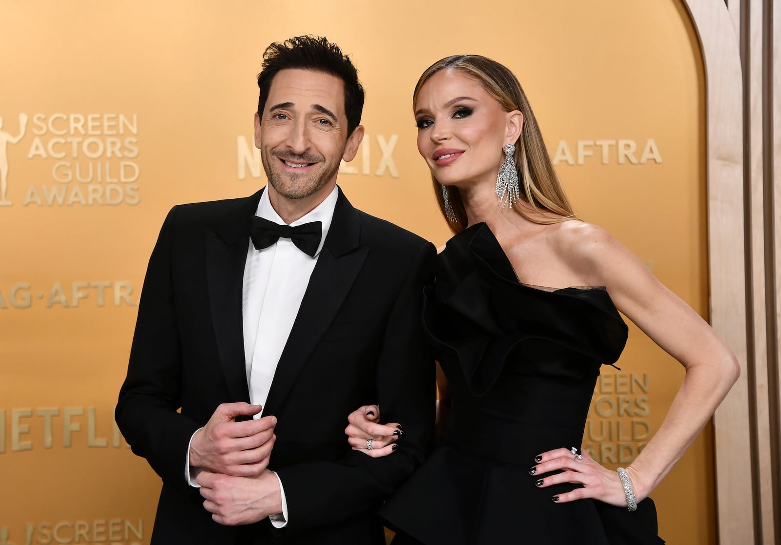 Adrien Brody, left, and Georgina Chapman arrive at the 31st annual Screen Actors Guild Awards on Sunday, Feb. 23, 2025, at the Shrine Auditorium in Los Angeles. (Photo by Richard Shotwell/Invision/AP)