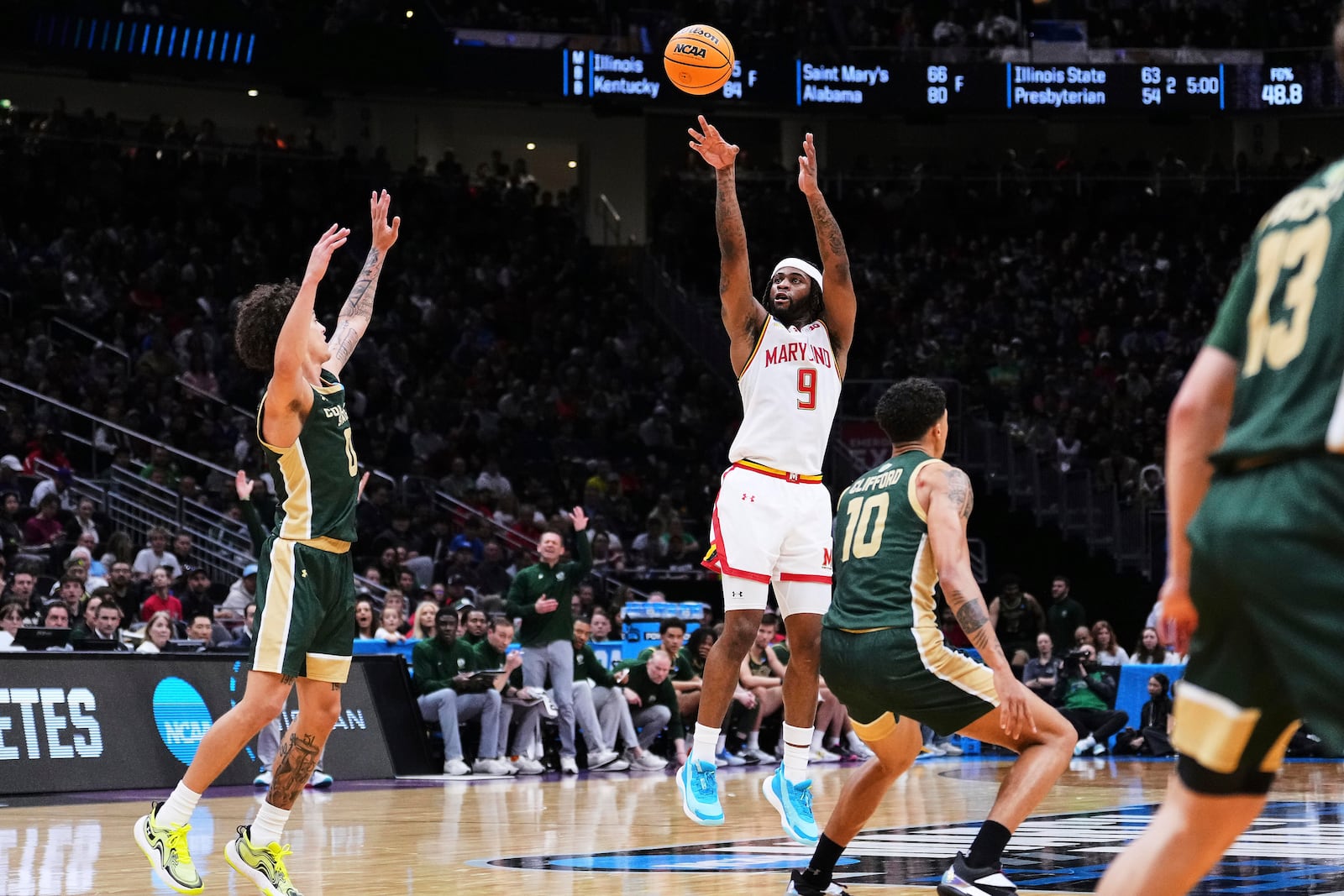 Maryland guard Selton Miguel (9) shoots against Colorado State guard Kyan Evans, left, during the second half in the second round of the NCAA college basketball tournament Sunday, March 23, 2025, in Seattle. (AP Photo/Lindsey Wasson)