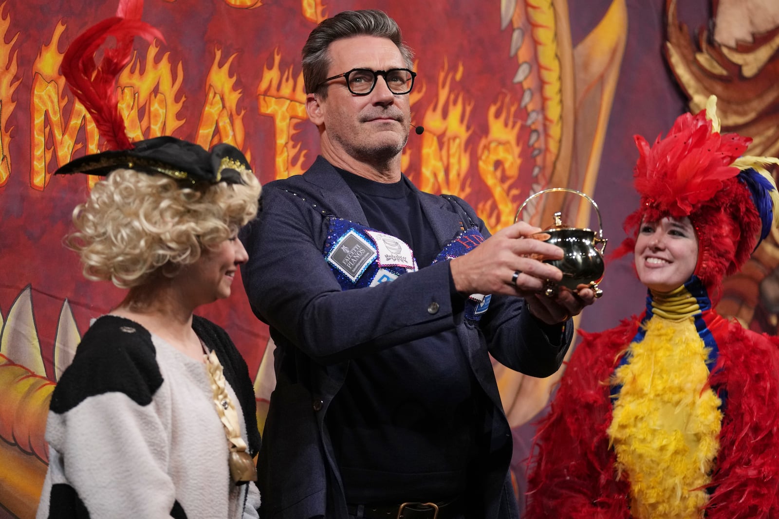 Harvard University's Hasty Pudding Theatricals Man of the Year Jon Hamm holds his award, Friday, Jan. 31, 2025, in Cambridge, Mass. (AP Photo/Charles Krupa)