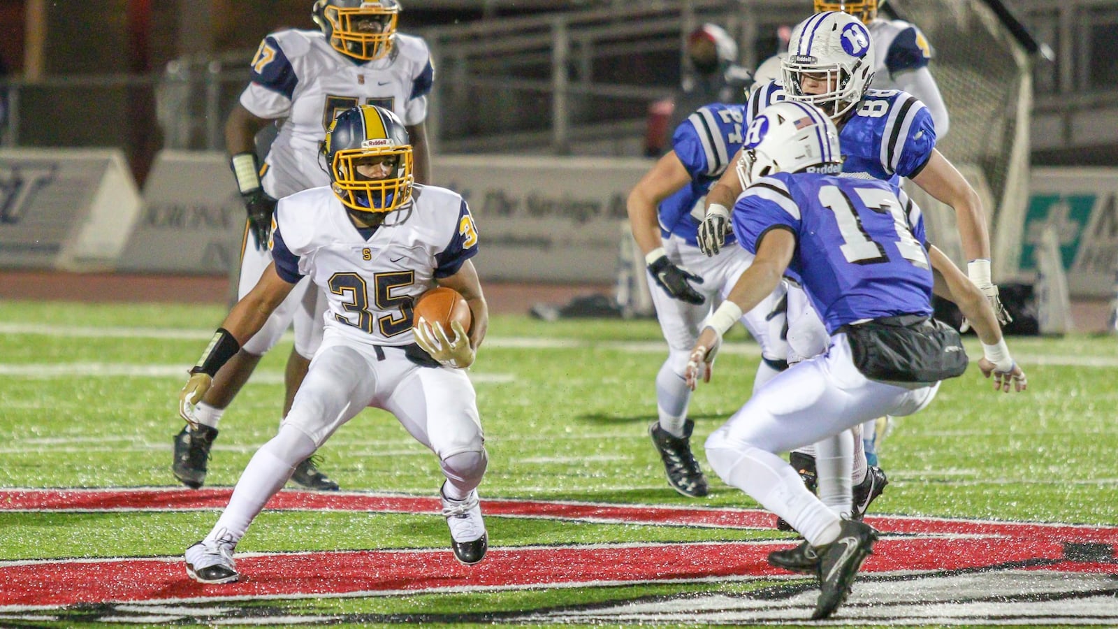 Springfield High School’s Jeff Tolliver runs the ball against Hilliard Davidson during their Division I, Region 3 semifinal game on Friday night at London High School. Hilliard Davidson won 17-14.