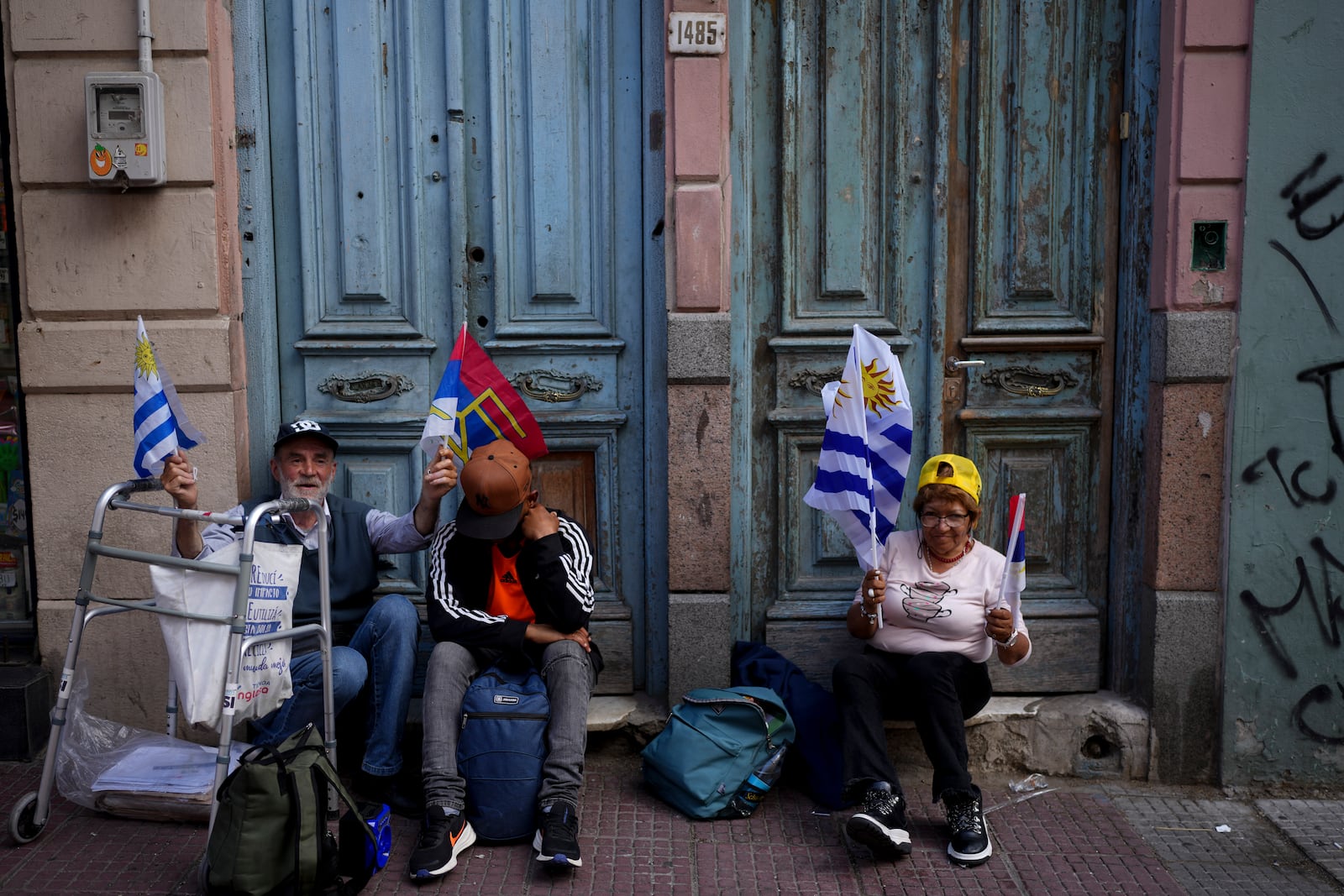 Supporters of Broad Front coalition presidential candidate Yamandu Orsi campaign one day ahead of the presidential run-off election, in Montevideo, Uruguay, Saturday, Nov. 23, 2024. (AP Photo/Natacha Pisarenko)