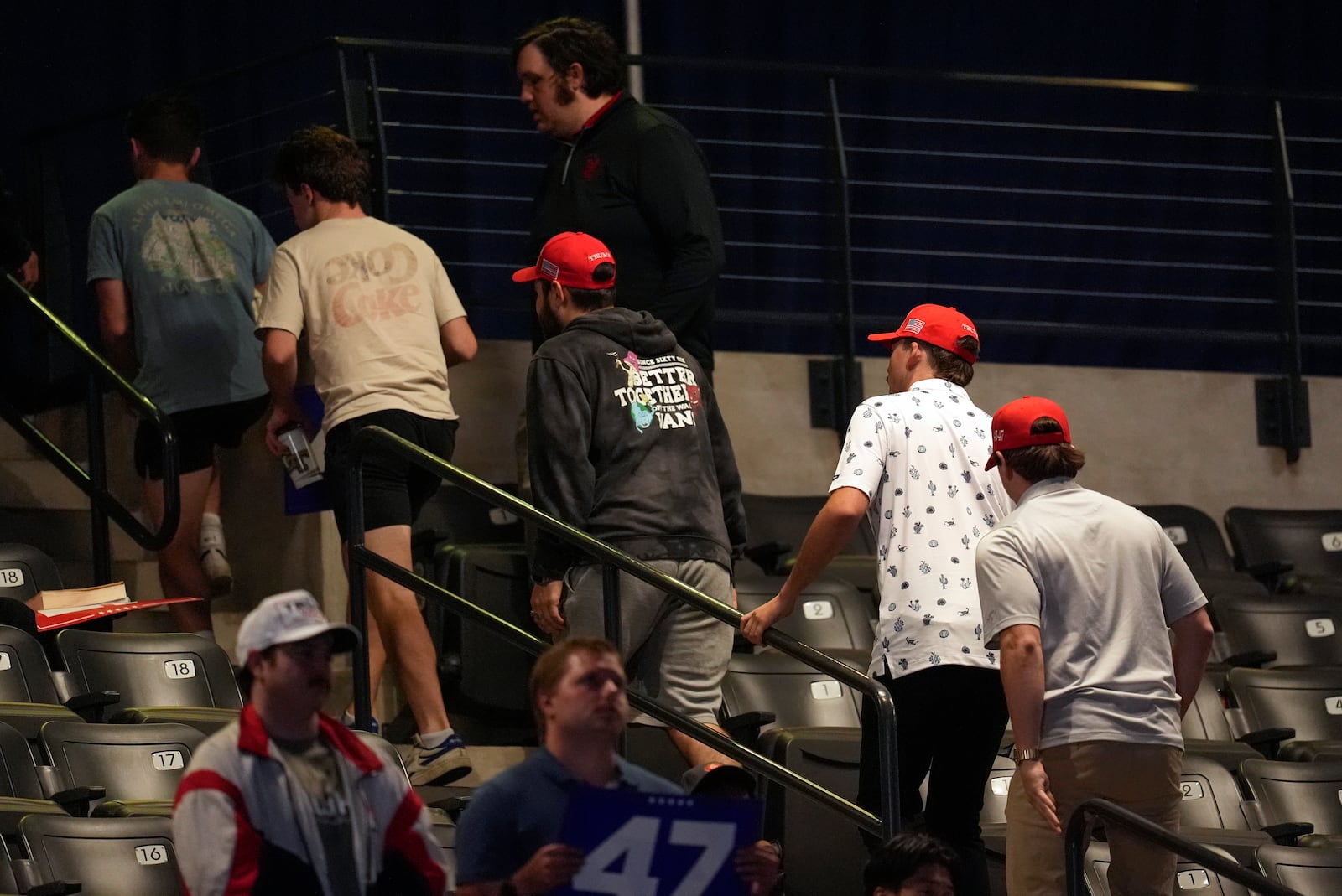 Supporters leave as Republican presidential nominee former President Donald Trump speaks at a campaign rally at McCamish Pavilion Monday, Oct. 28, 2024, in Atlanta. (AP Photo/Mike Stewart)