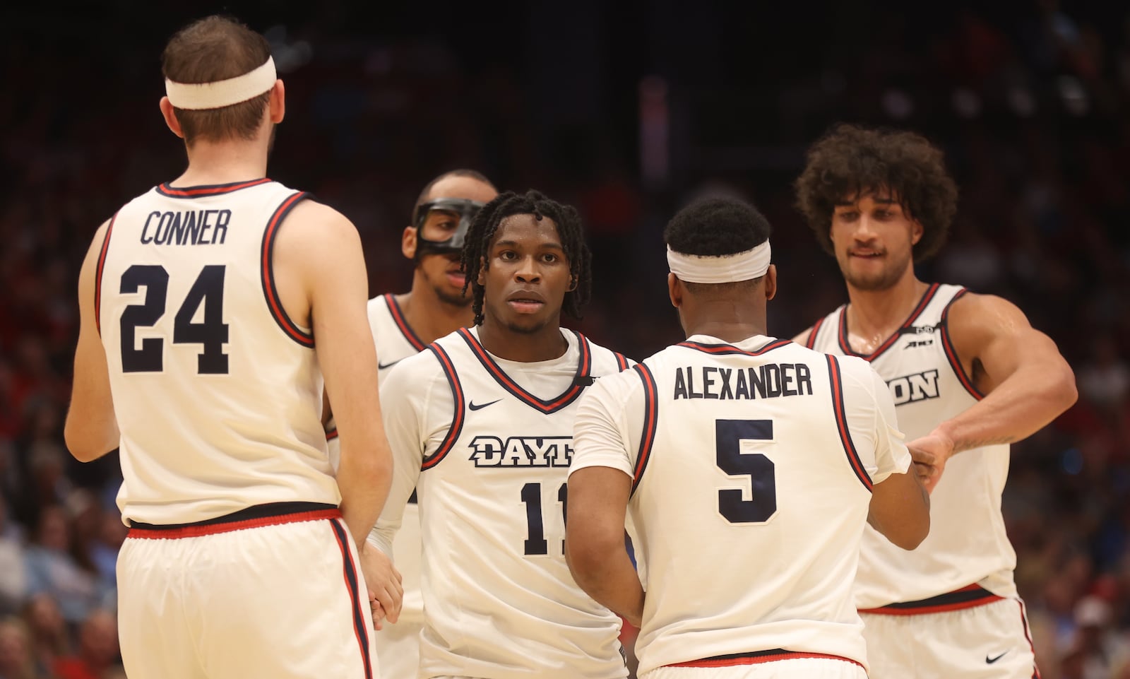 Dayton players huddle during a game against Saint Francis on Monday, Nov. 4, 2024, at UD Arena. David Jablonski/Staff