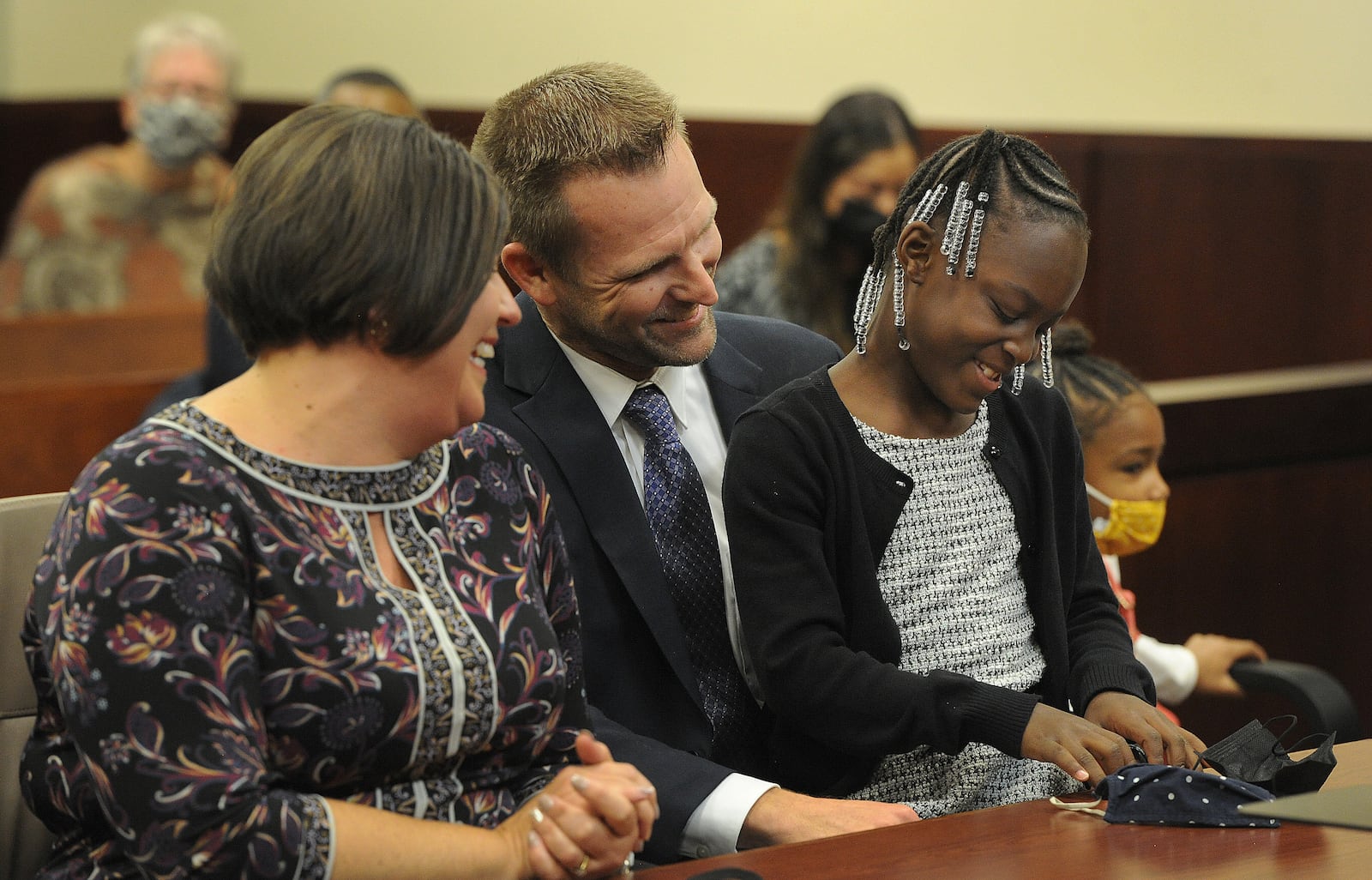 Amy and David Dobson adopt 7 year-old Nevaeh on Adoption Day at the Montgomery County Probate Court Friday, November 19, 2021. MARSHALL GORBY\STAFF