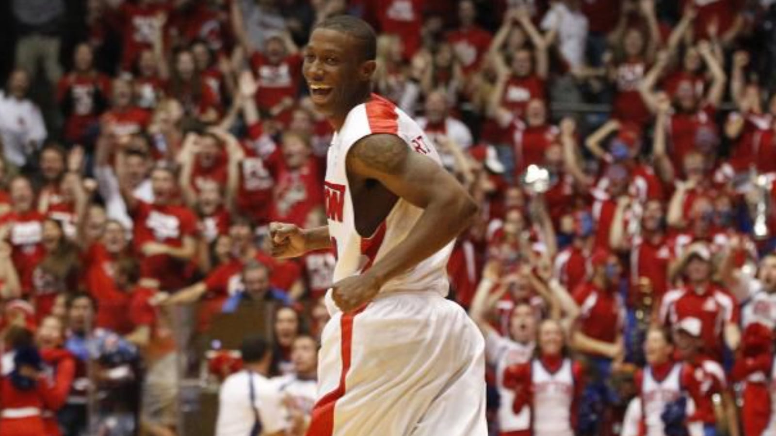 Jordan Sibert smiles as he runs back up court after a game-winning 3-pointer with 1 second left against IPFW on Saturday, Nov. 9, 2013, at UD Arena. David Jablonski/Staff