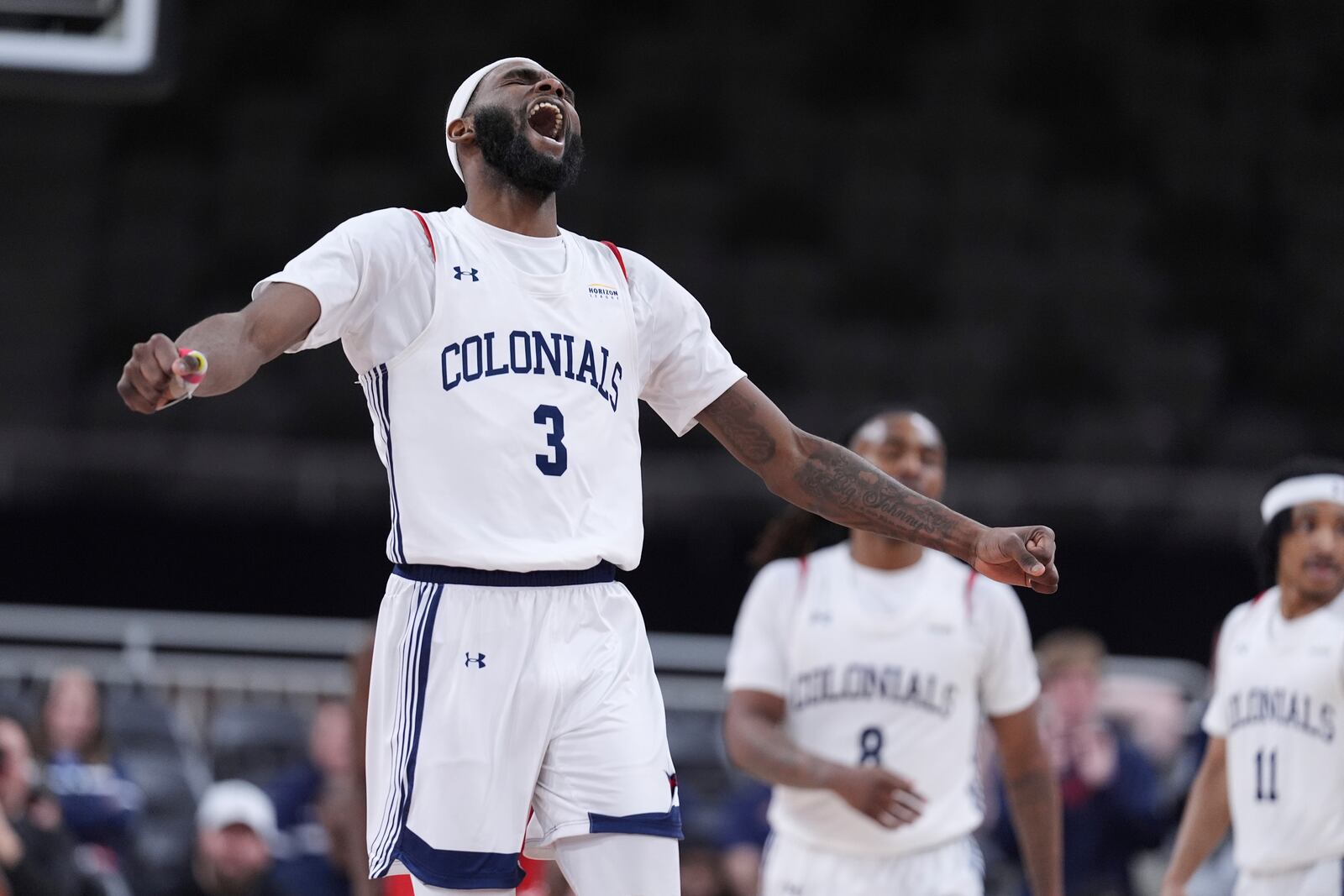 Robert Morris guard Amarion Dickerson (3) celebrates in the second half of an NCAA college basketball game in the championship of the Horizon League tournament against Youngstown State in Indianapolis, Tuesday, March 11, 2025. (AP Photo/Michael Conroy)