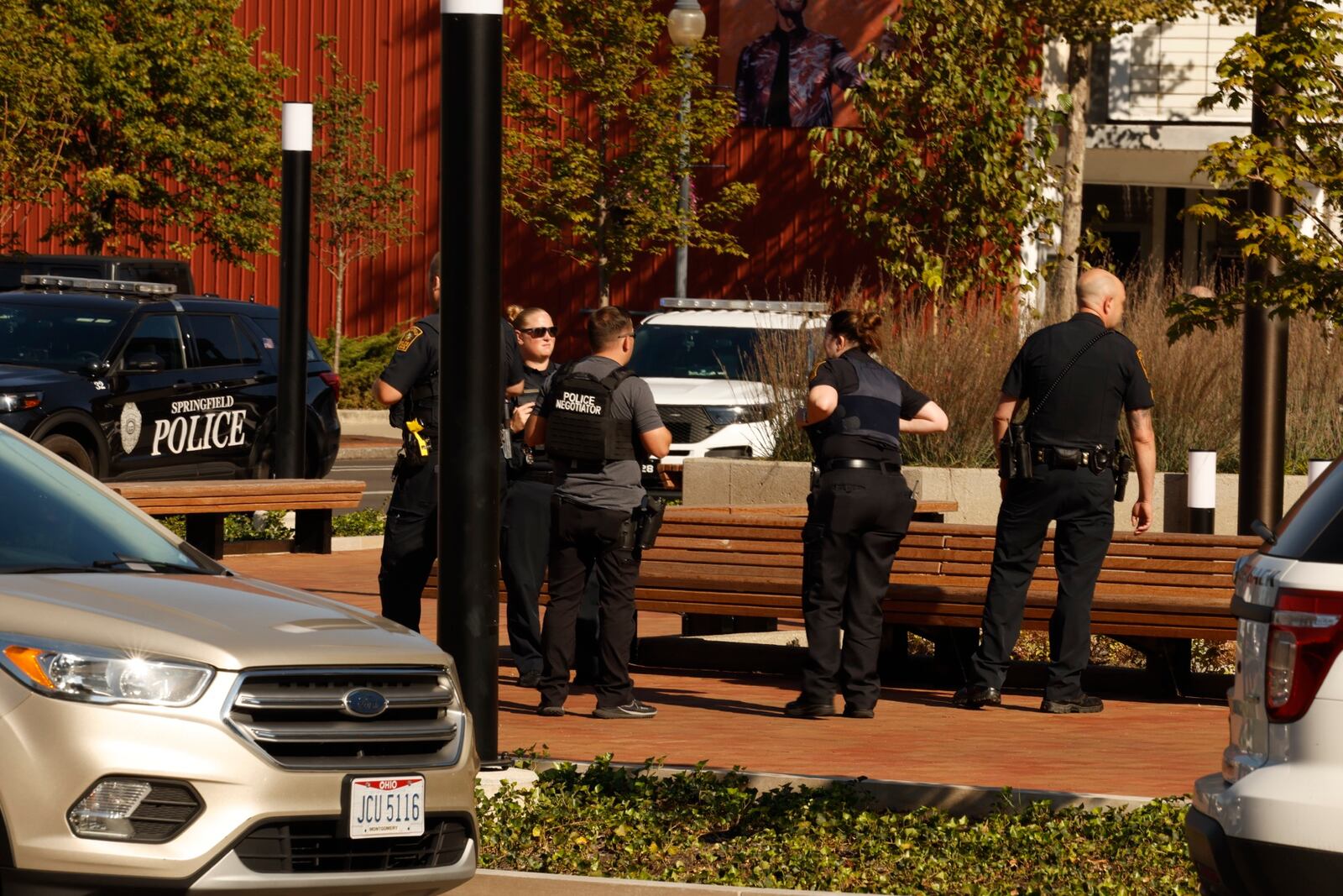 Springfield, Dayton police, along with the State Highway Patrol search the Springfield City Hall after it was evacuated due to a threat Thursday. BILL LACKEY/STAFF