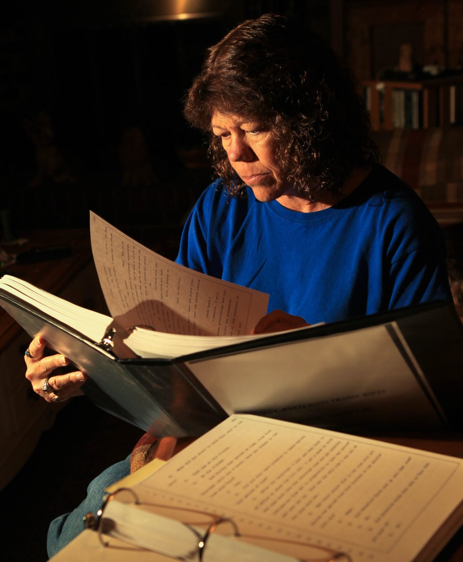 Nan Day looks over court transcripts from the trial when she was a member of the jury that convicted Tyra Patterson of aggravated murder 19 years ago. Now Day is convinced that Patterson is innocent and her conviction was “a miscarriage of justice.” She believes Patterson, who was 19 at the time, was coerced into confessing to robbing shooting victim Michelle Lai, a confession that led to her aggravated murder conviction even though no one ever claimed Patterson was the killer. Day also said critical information was withheld from the jury that would have resulted in a different verdict. JIM WITMER / STAFF