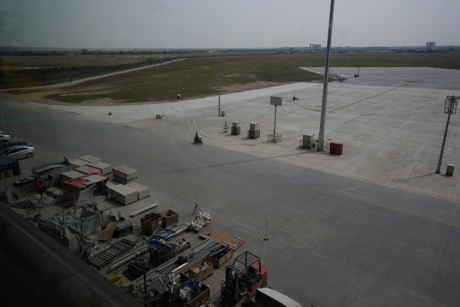 An overview from beside of parking airplane of an under construction of a new airport of Techo International Airport at the outskirts of Phnom Penh Cambodia, Friday, March 21, 2025. (AP Photo/Heng Sinith)