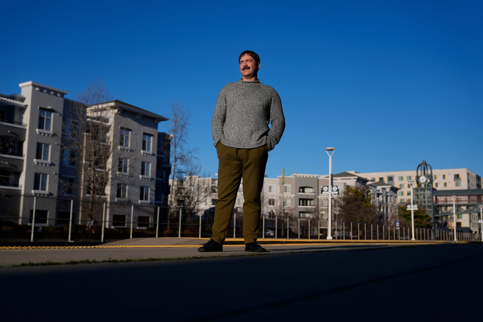 Jonah Paul, Digital Marketing Analyst at Employment Development Department, stands for photographs at the Jack London Square Amtrak Train station in Oakland, Calif., Friday, March 7, 2025. (AP Photo/Jeff Chiu)