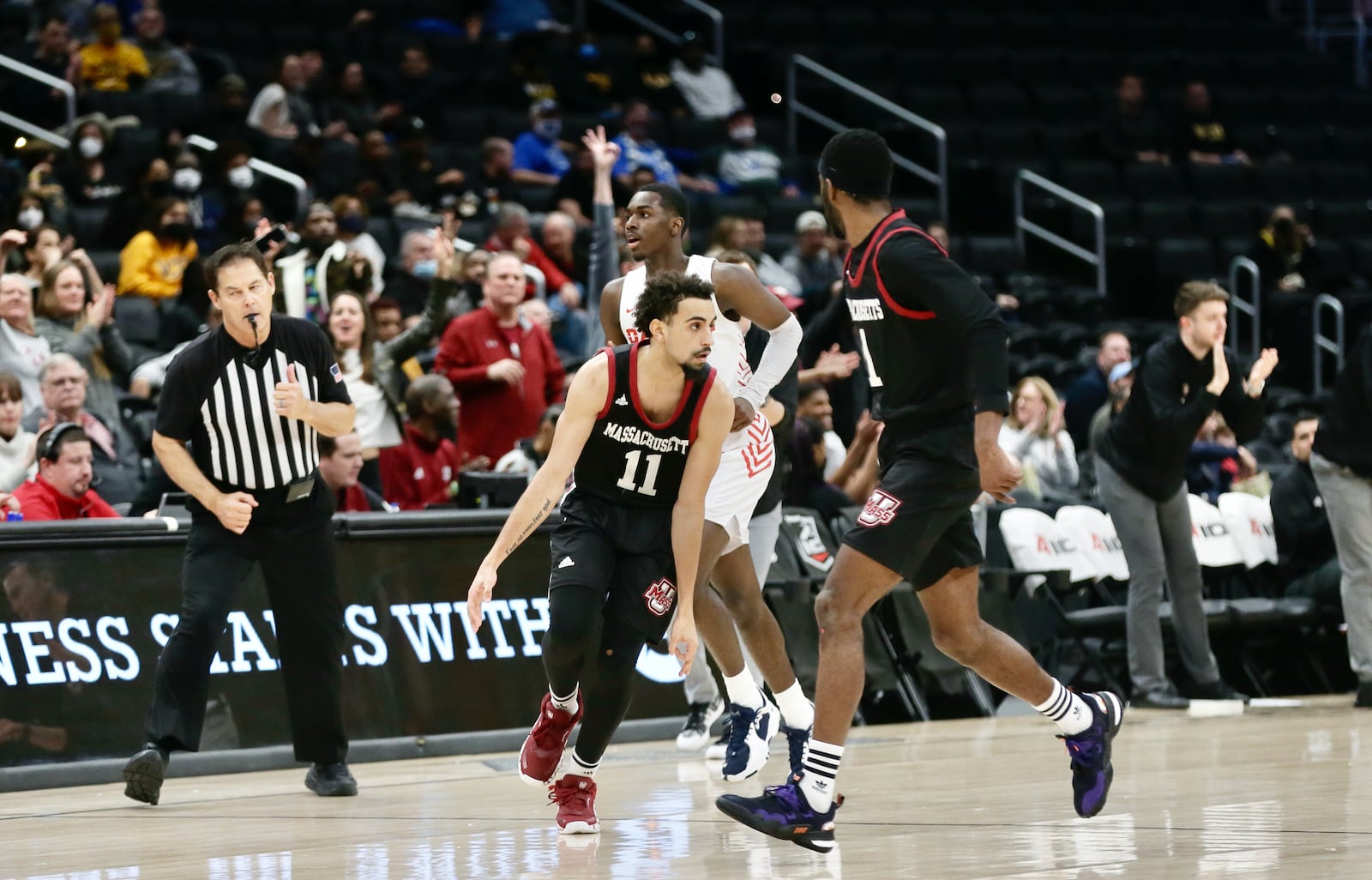 Massachusetts guard Noah Fernandes celebrates after scoring against Dayton in the second half in the Atlantic 10 Conference quarterfinals on Friday, March 11, 2022, at Capital One Arena in Washington, D.C. David Jablonski/Staff