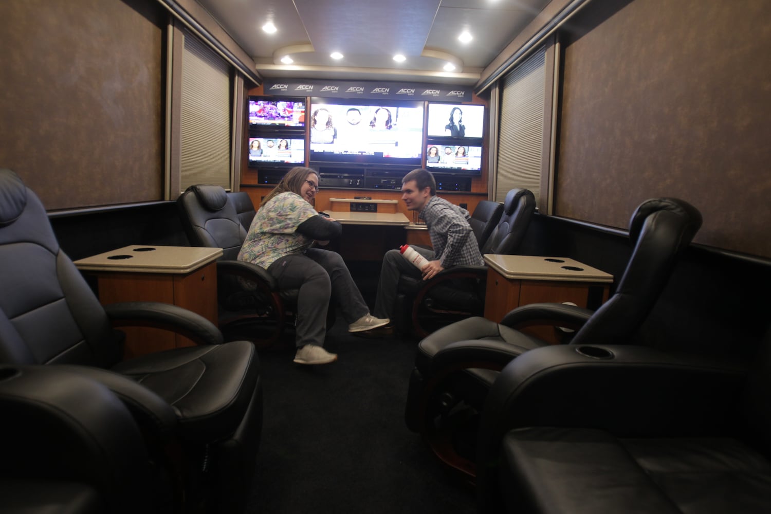 College basketball fans get an early view  of the ESPN College GameDay bus in Huber Heights at the Krogers on Old Troy Pike Thursday.