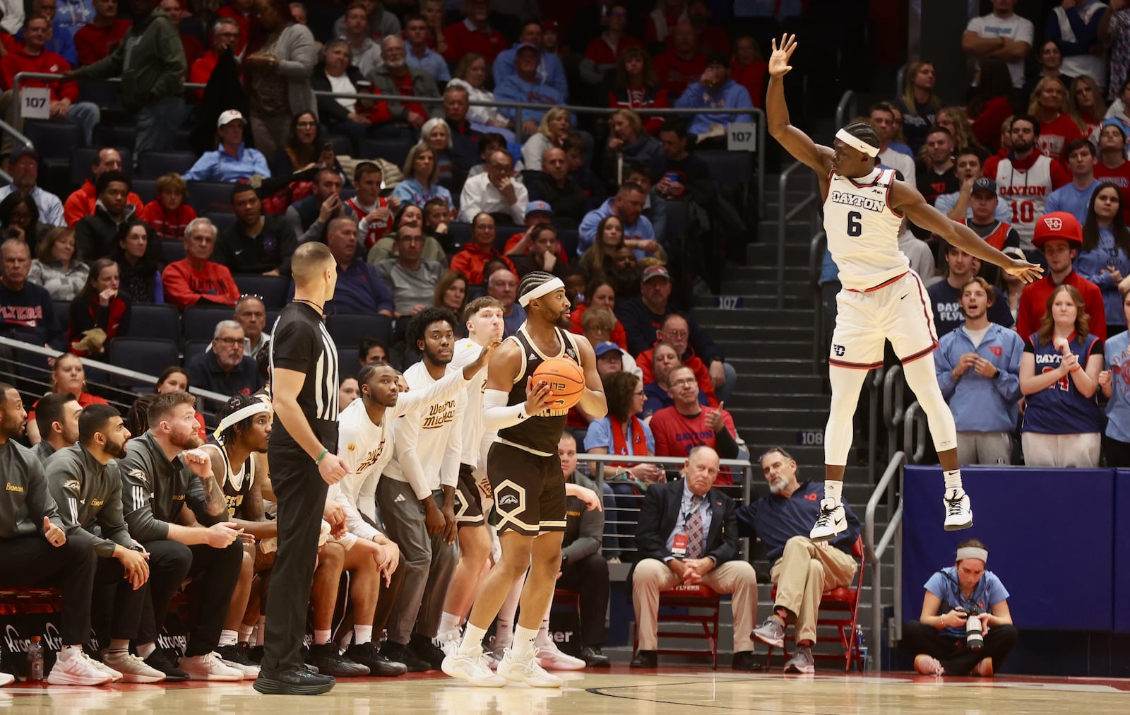 Dayton's Enoch Cheeks jumps to defend a 3-pointer against Western Michigan in the second half on Tuesday, Dec. 3, 2024, at UD Arena. David Jablonski/Staff