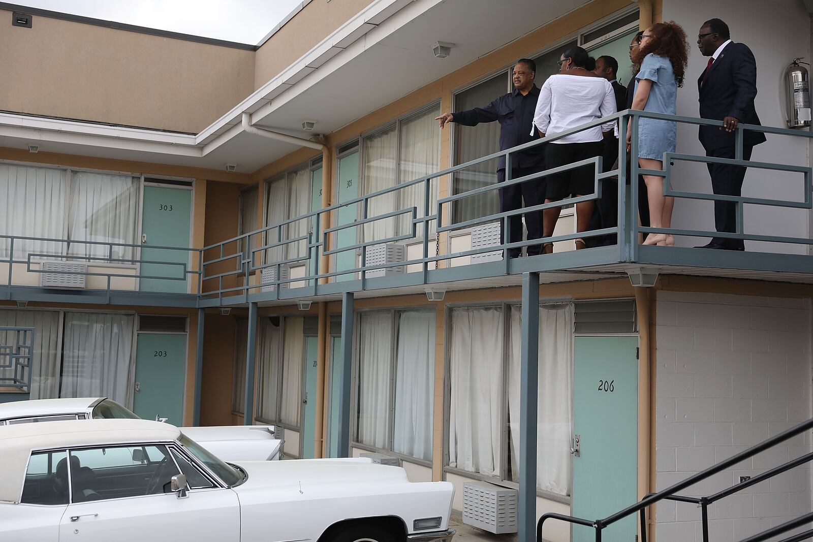 MEMPHIS, TN - APRIL 03:  Rev. Jesse Jackson (pointing) stands with his family on the balcony outside room 306 at the Lorraine Motel, where he was when Dr. Martin Luther King, Jr. was assassinated,.The motel is now part of the complex of the National Civil Rights Museum, which is commemorating the 50th anniversary of King's assassination on April 4, 1968.  (Photo by Joe Raedle/Getty Images)