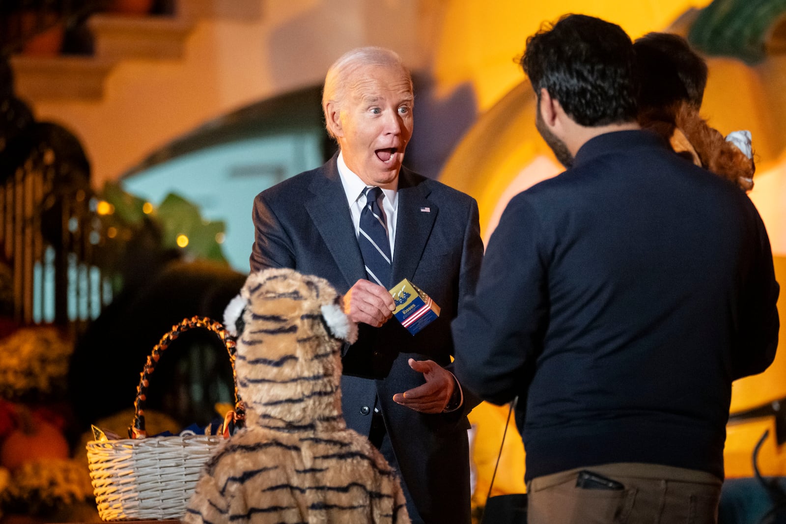 President Joe Biden hosts local area students, military-connected children, and neighborhood families for trick-or-treating, ahead of Halloween on Thursday, at the South Lawn of the White House in Washington Wednesday, Oct. 30, 2024. (AP Photo/Ben Curtis)