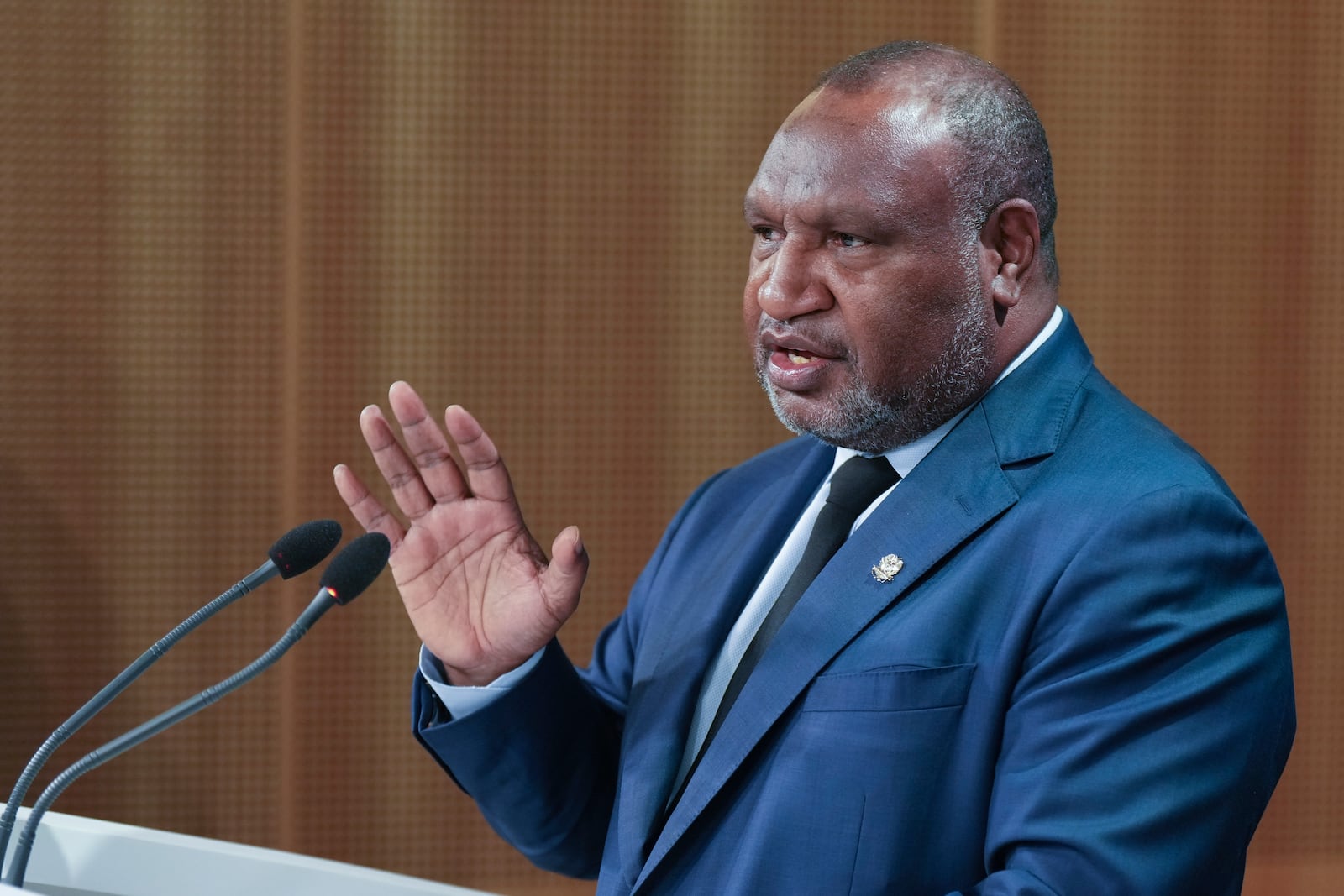 Papua New Guinea Prime Minister James Marape gestures during a press conference with Australian Prime Minister Anthony Albanese in Sydney, Australia, Thursday, Dec. 12, 2024. (AP Photo/Mark Baker)