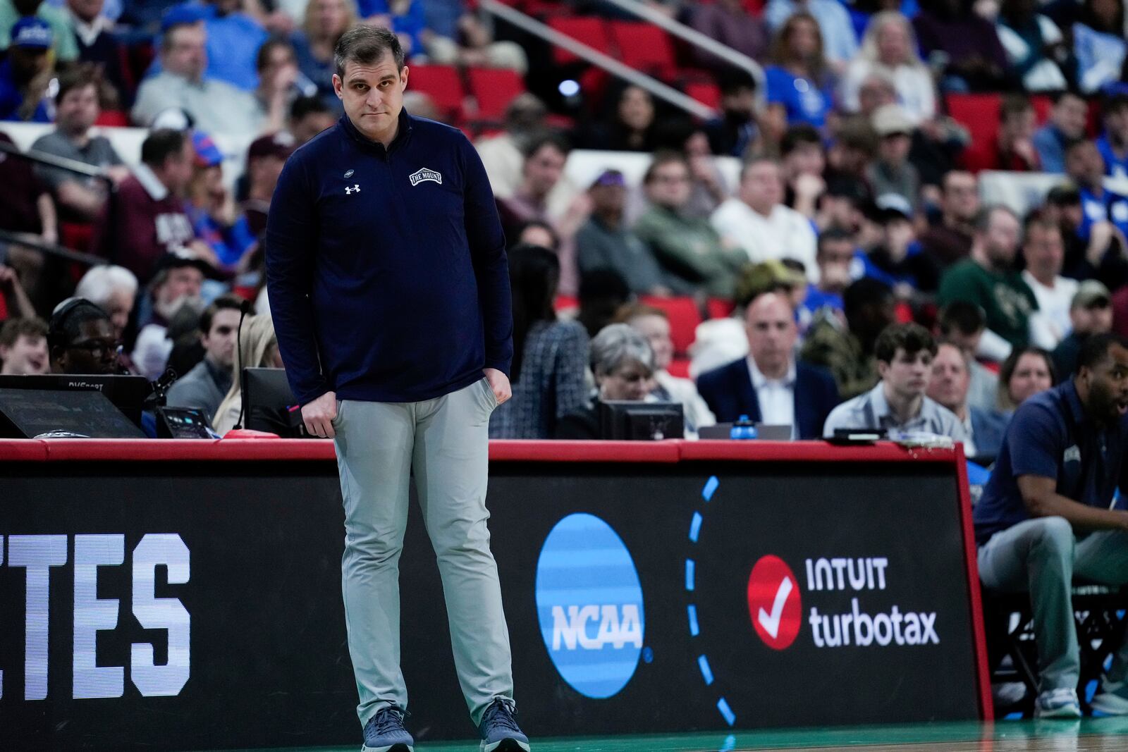 Mount St. Mary's head coach Donny Lind watches during the first half in the first round of the NCAA college basketball tournament against Duke, Friday, March 21, 2025, in Raleigh, N.C. (AP Photo/Stephanie Scarbrough)