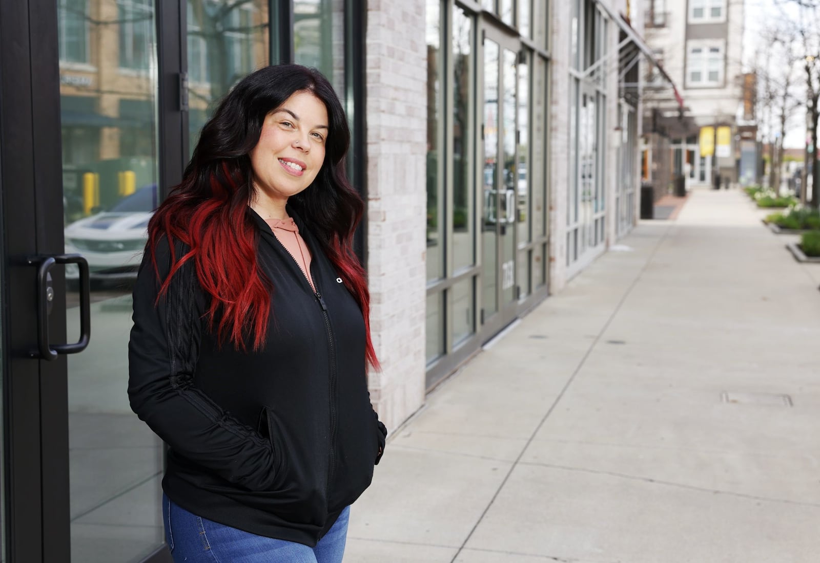 Melissa Portillo stands in front of the storefront where her restaurant, Sandwich Cafe and Deli, will be located at Liberty Center. NICK GRAHAM / STAFF