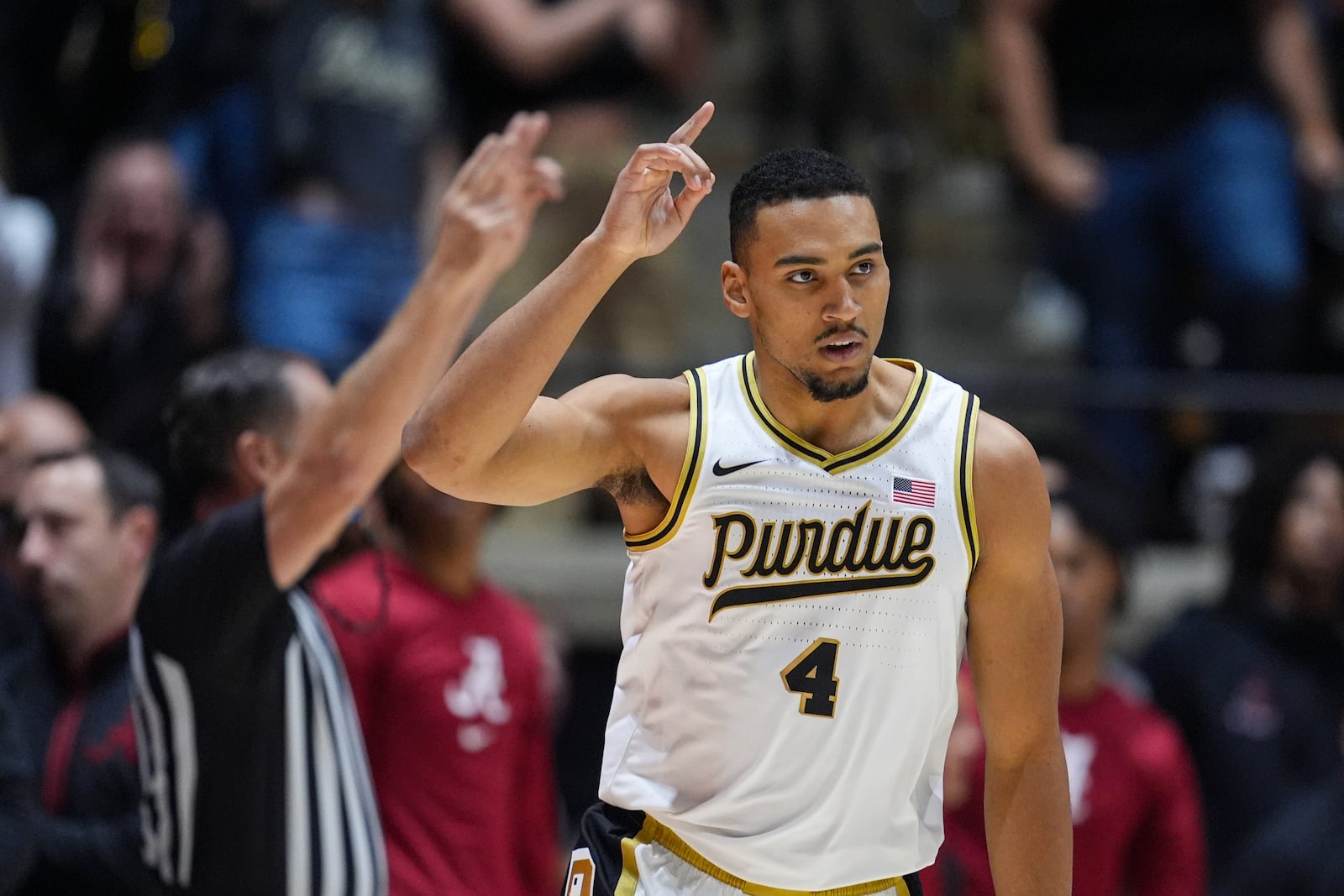 Purdue forward Trey Kaufman-Renn (4) celebrates after a three-point basket against Alabama during the first half of an NCAA college basketball game in West Lafayette, Ind., Friday, Nov. 15, 2024. (AP Photo/Michael Conroy)