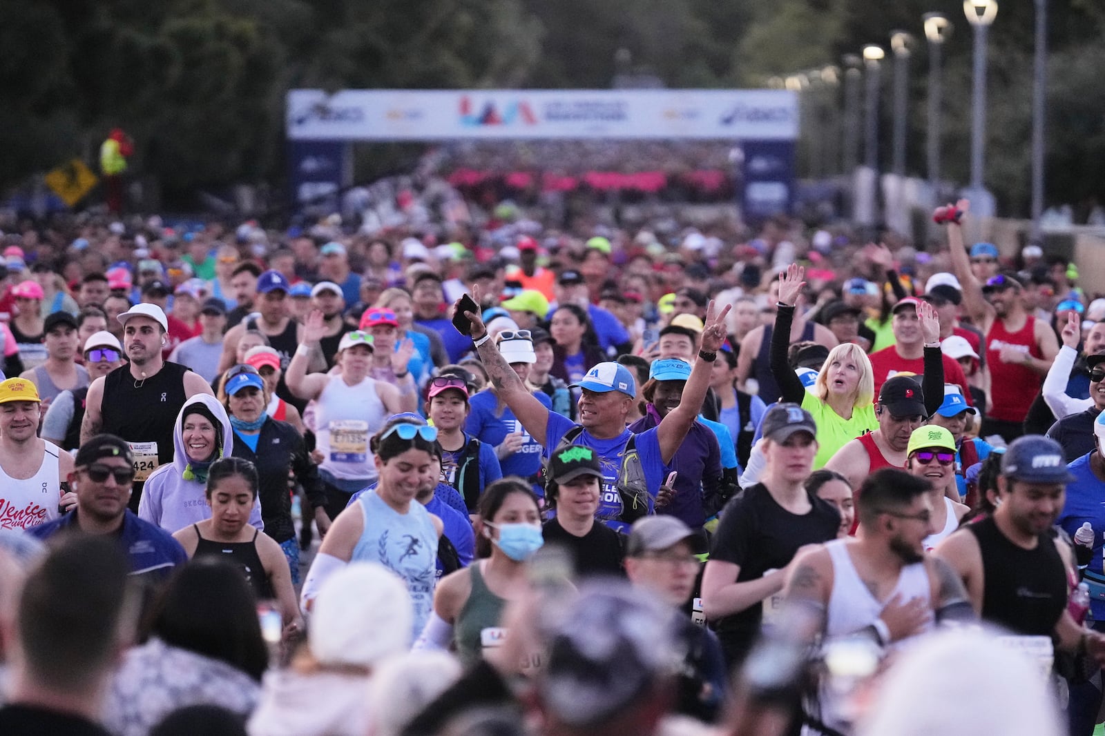 Participants prepare for the start of the Los Angeles Marathon Sunday, March 16, 2025, in Los Angeles. (AP Photo/Eric Thayer)