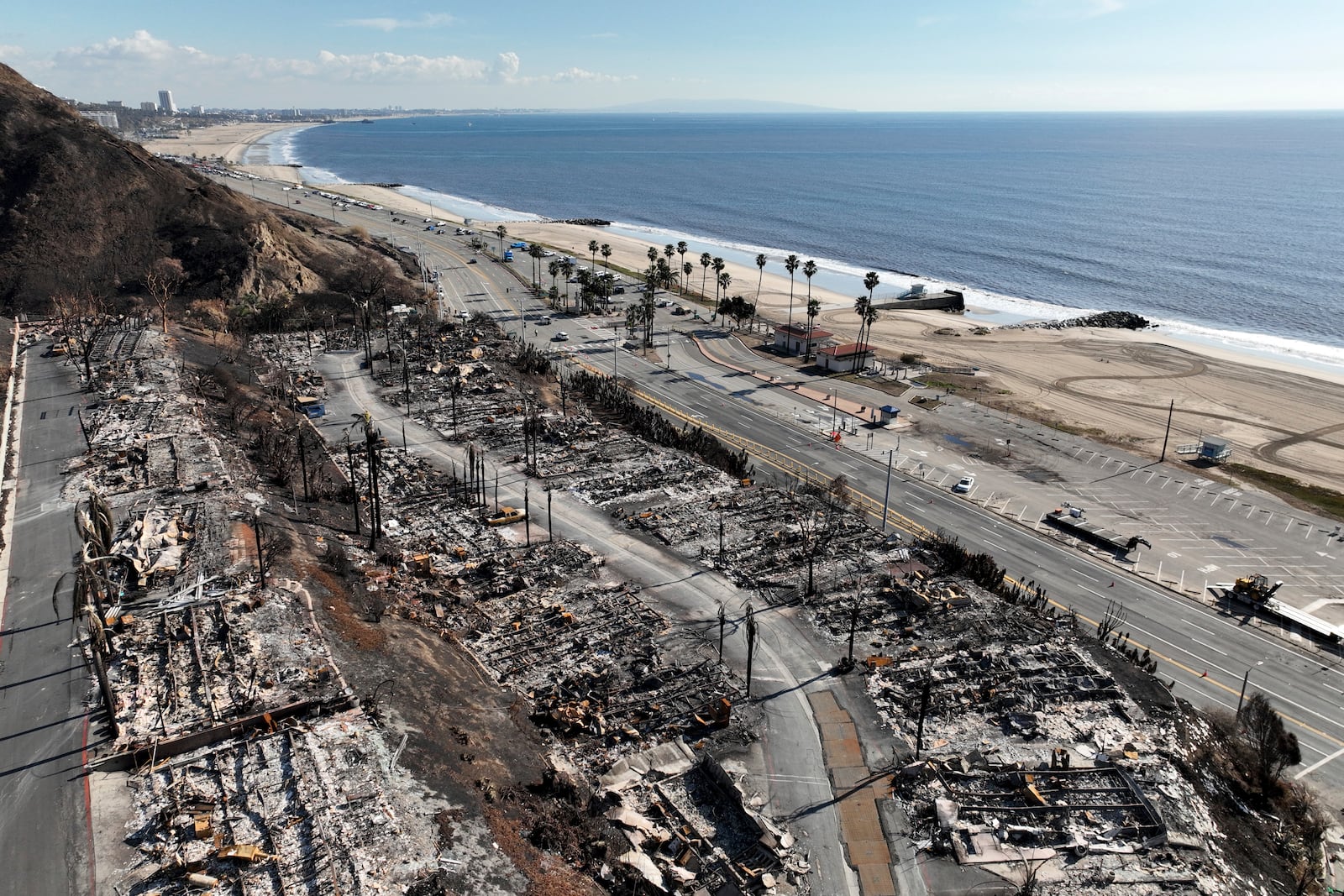 An aerial view shows the devastation left by the Palisades Fire in the Pacific Palisades section of Los Angeles, Monday, Jan. 27, 2025. (AP Photo/Jae C. Hong)