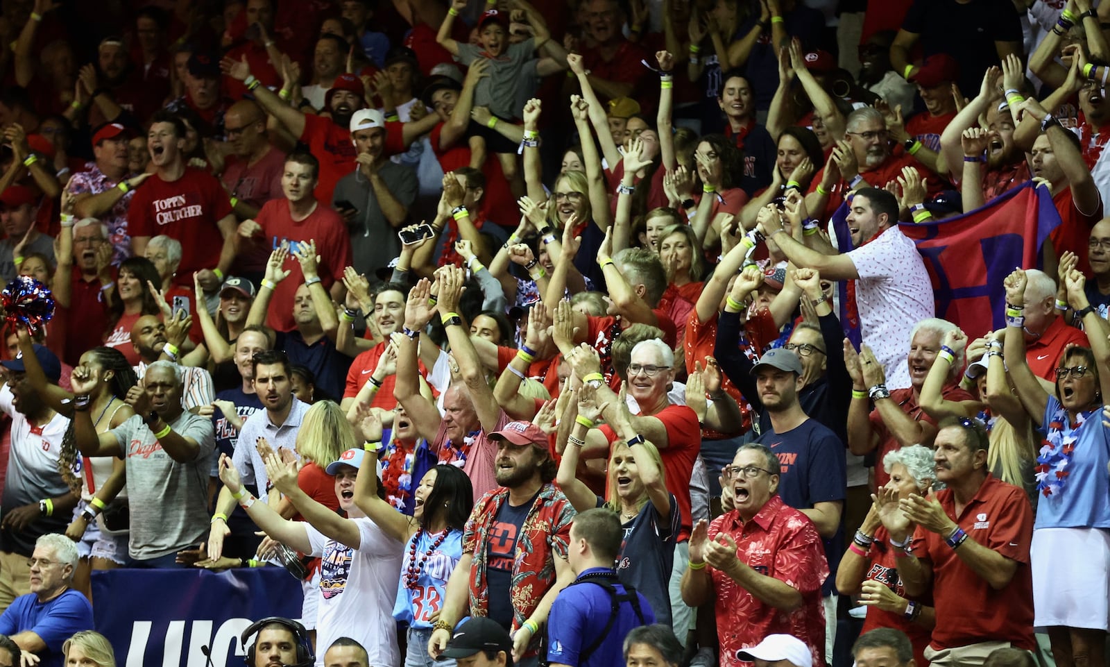 Dayton fans celebrate during a first-half run against North Carolina in the first round of the Maui Invitational on Monday, Nov. 25, 2024, at the Lahaina Civic Center. David Jablonski/Staff