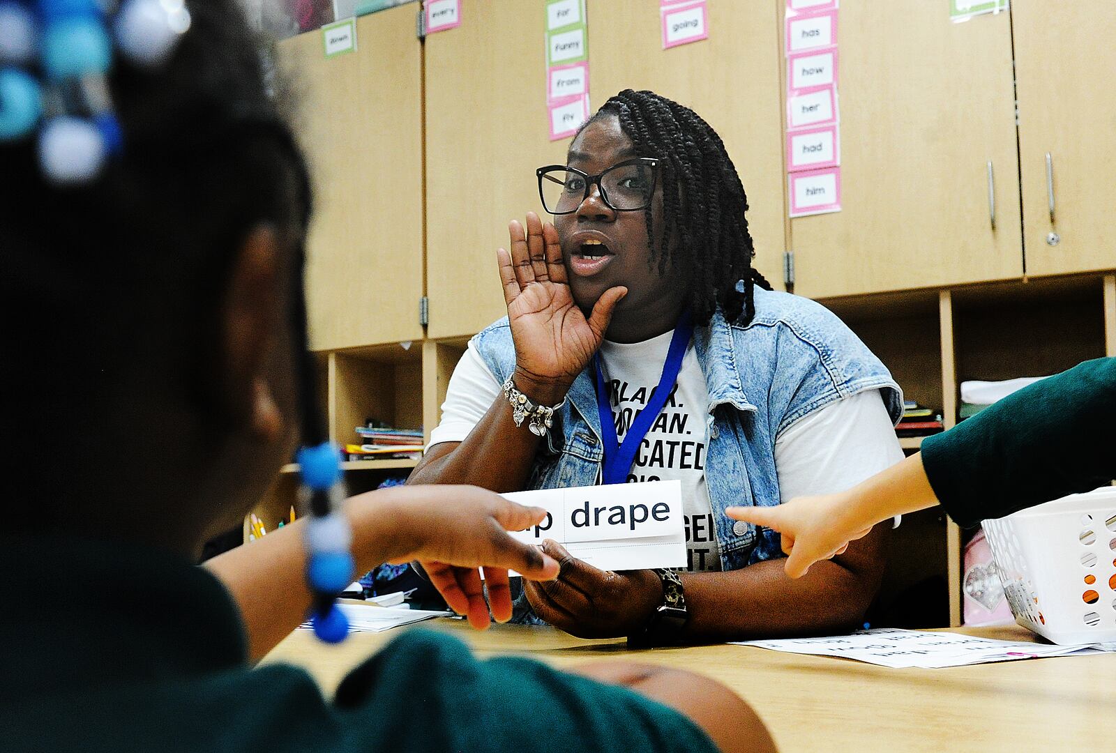 Sabrina Williams a teacher at Valerie Elementary in Dayton works on reading words with students Thursday Feb. 9, 2023. MARSHALL GORBY\STAFF