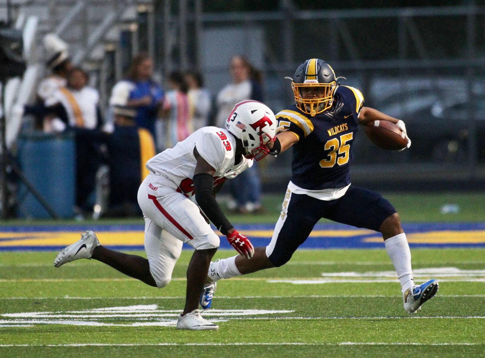 Springfield's Jeff Tolliver runs against Fairfield's Nykel Bell on Friday, Sept. 6, 2019, at Springfield High School. David Jablonski/Staff