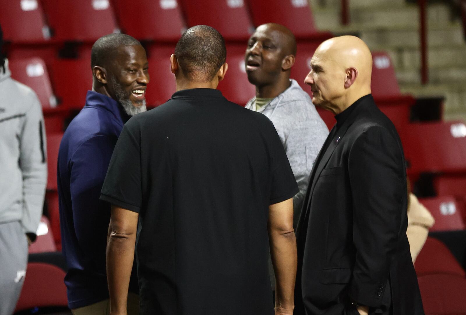 Dayton's Anthony Grant, left, talks to  Massachusetts coach Frank Martin, right, after the game on Wednesday, Feb. 22, 2023, at the Mullins Center in Amherst, Mass. David Jablonski/Staff