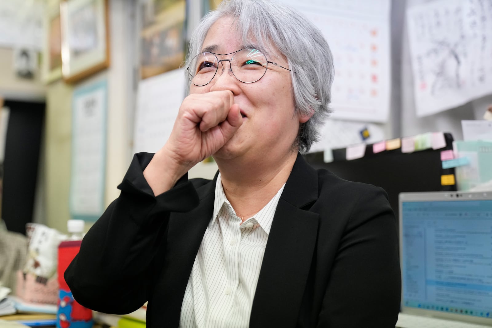 Masako Kudo, an official of Nihon Hidankyo, or the Japan Confederation of A- and H-Bomb Sufferers Organizations, reacts as she speaks to media members at its Tokyo office in Tokyo, Friday, Oct. 11, 2024, following Ninon Hidankyo's winning the Nobel Peace Prize. (AP Photo/Shuji Kajiyama)