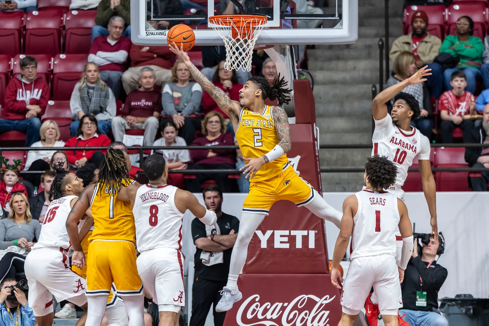 Kent State guard Marquis Barnett (2) shoots under the basket past Alabama forward Mouhamed Dioubate (10) during the first half of an NCAA college basketball game, Sunday, Dec. 22, 2024, in Tuscaloosa, Ala. (AP Photo/Vasha Hunt)