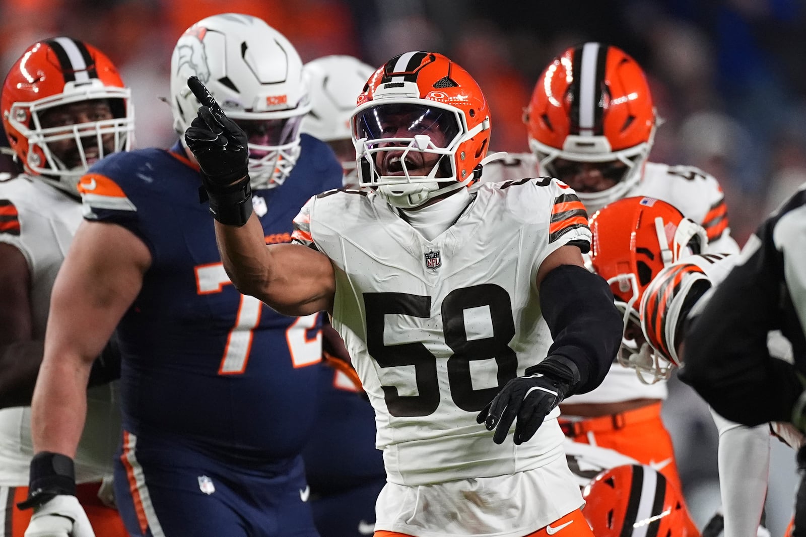 Cleveland Browns linebacker Jordan Hicks (58) reacts after a play during the first half of an NFL football game against the Denver Broncos, Monday, Dec. 2, 2024, in Denver. (AP Photo/David Zalubowski)