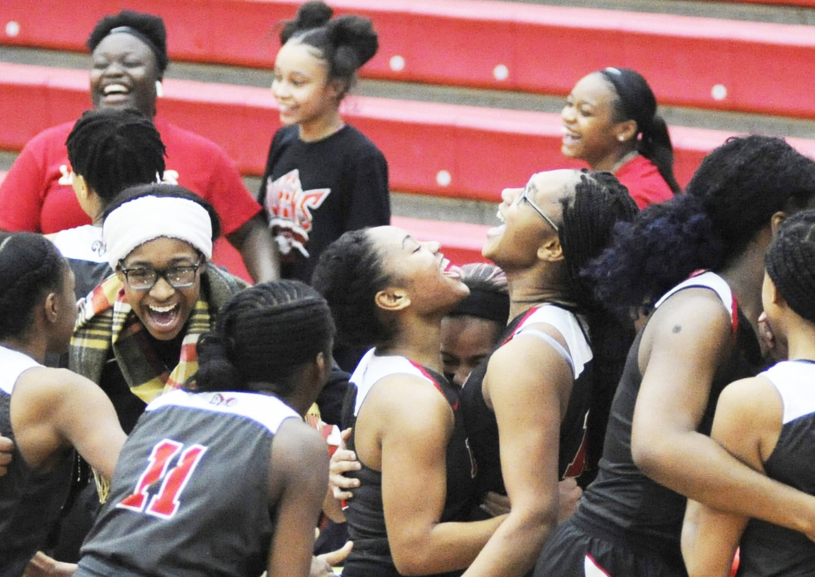 Trotwood-Madison players celebrate after a 37-35 girls high school basketball win at Tippecanoe on Thursday, Jan. 24, 2019. MARC PENDLETON / STAFF