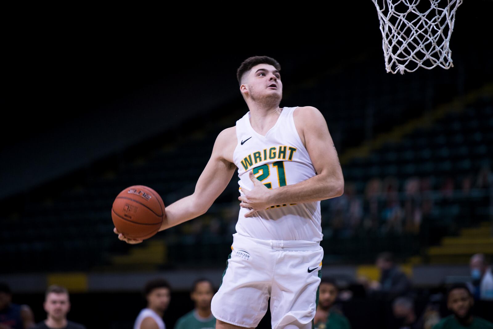 Wright State's Grant Basile goes up for a dunk during a game vs. Robert Morris at the Nutter Center on Friday, Jan. 29, 2021. Joseph Craven/Wright State Athletics