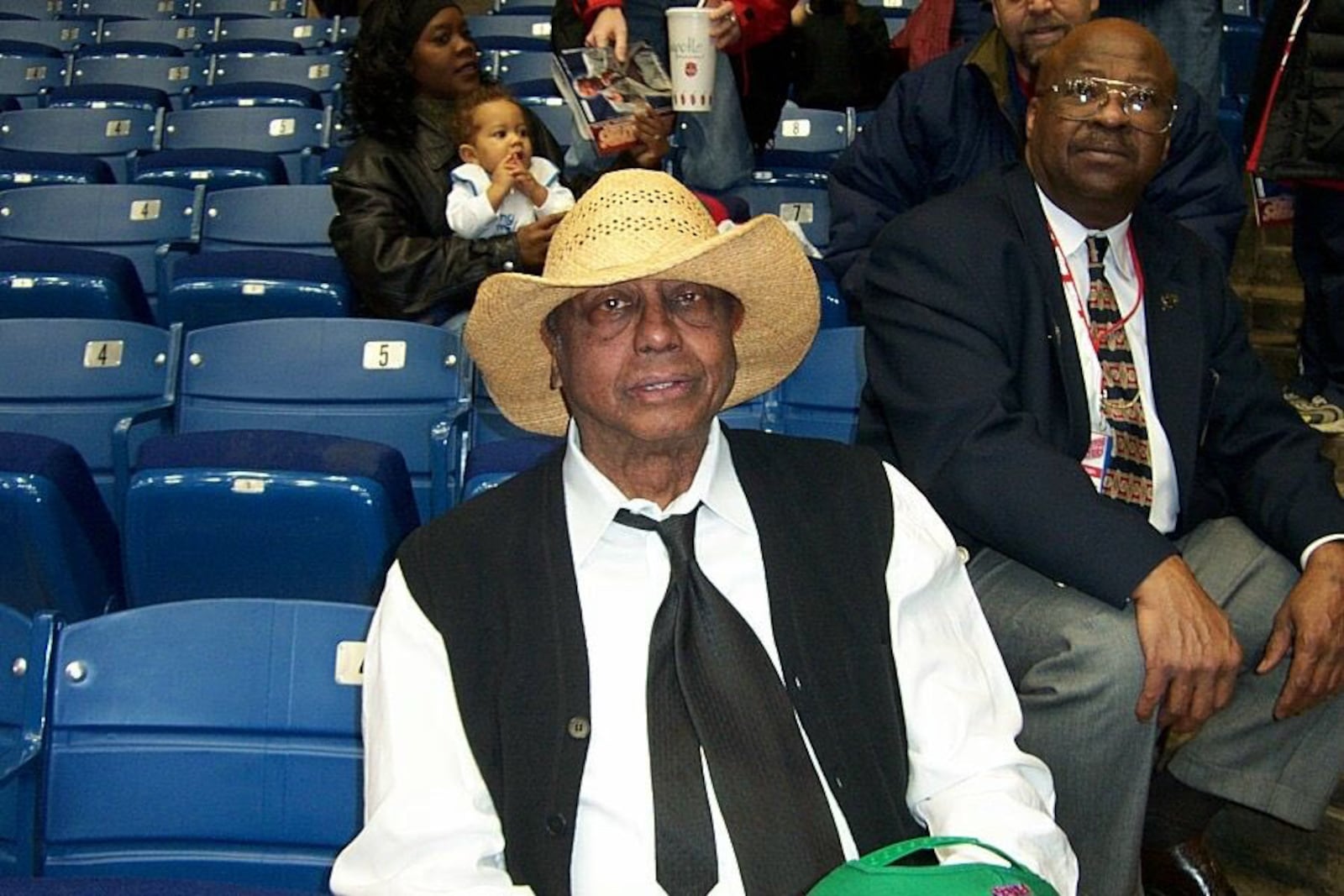 Temple coach John Chaney wears a straw hat given to him by Dayton students before a game at UD Arena on Feb. 27, 2002. Photo courtesy of Greg Popham II