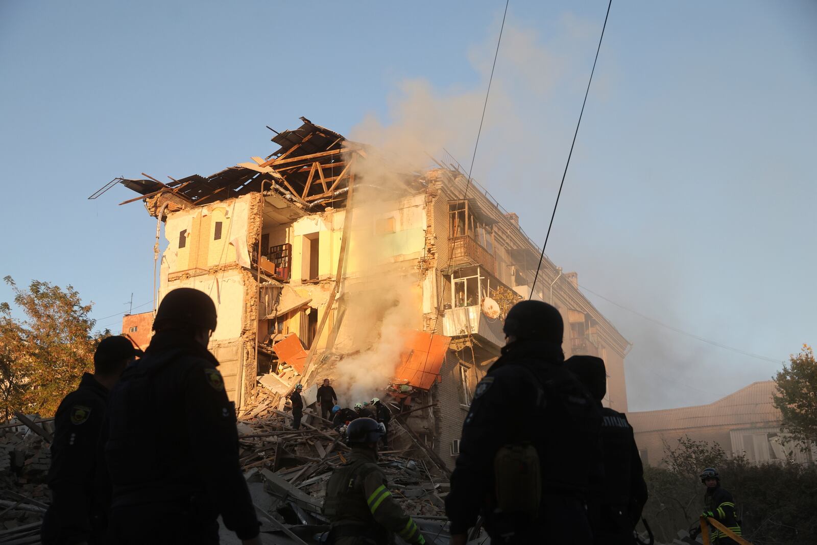 Rescue workers clear the rubble of a residential building destroyed by a Russian airstrike in Zaporizhzhia, Ukraine, Thursday, Nov. 7, 2024. (AP Photo/Kateryna Klochko)