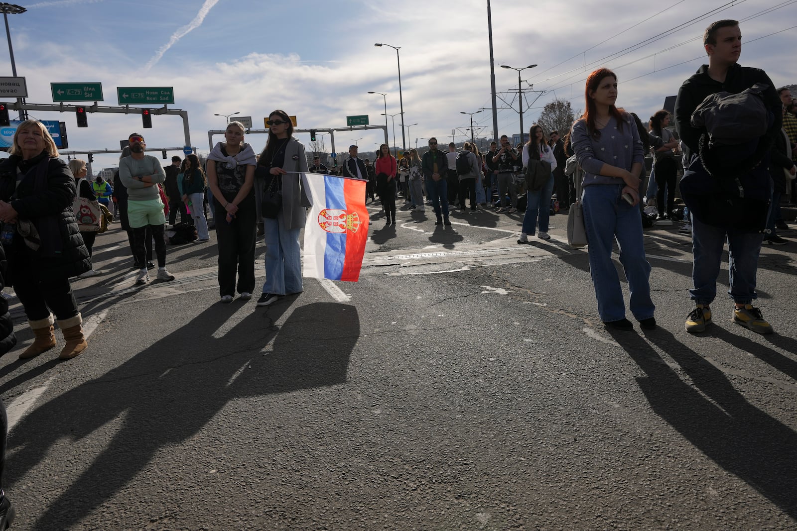 People take part in a student-led 24 hour block on an intersection to protest the deaths of 15 people killed in the November collapse of a train station canopy, in Belgrade, Serbia, Monday, Jan. 27, 2025. (AP Photo/Darko Vojinovic)