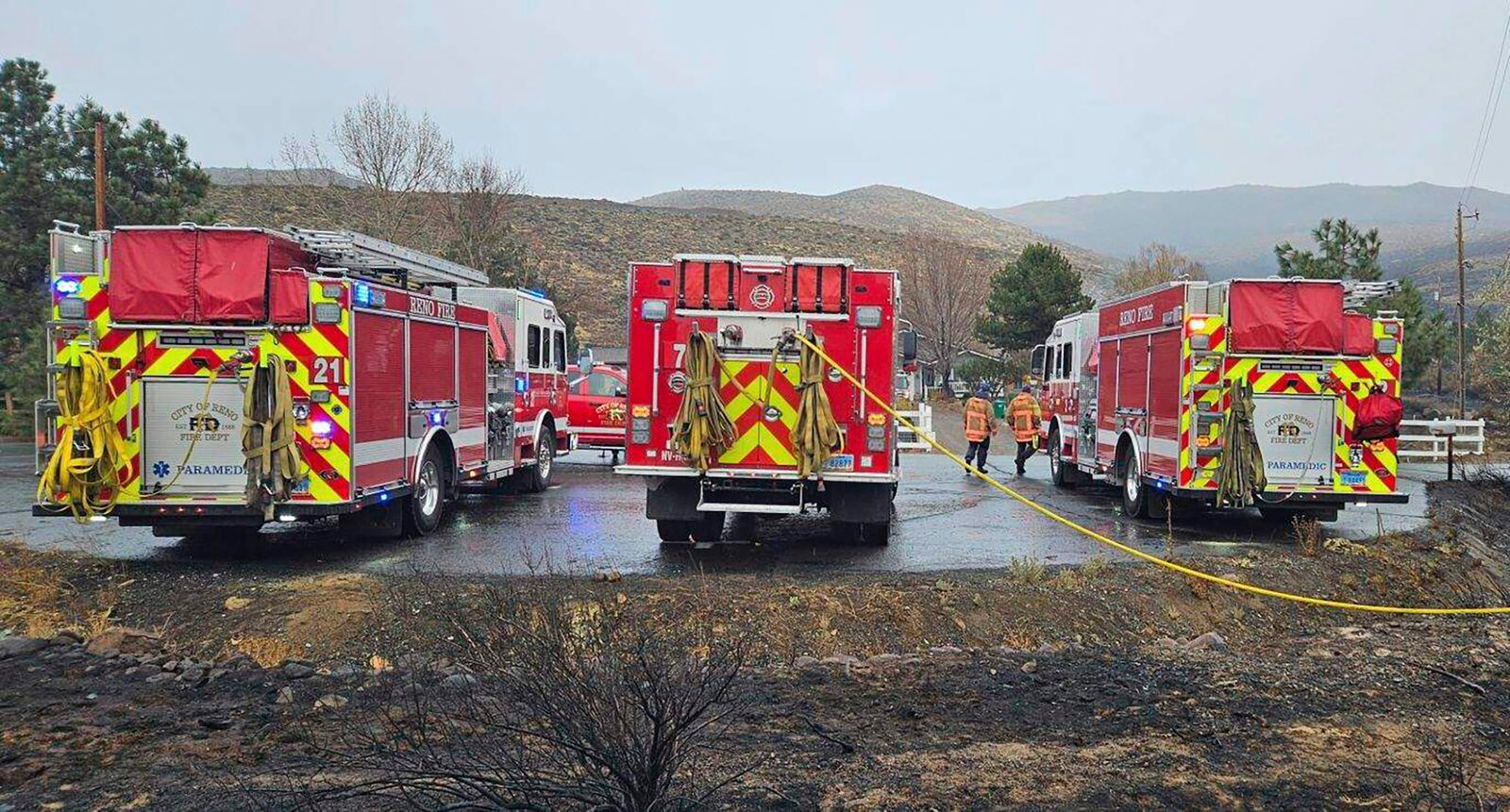 In this handout photo provided by the Reno Fire Department, fire crews battle the Callahan Fire, which caused the evacuations of hundreds of homes southwest of Reno, Nev., Monday, Nov. 11, 2024. (Reno Fire Department via AP)