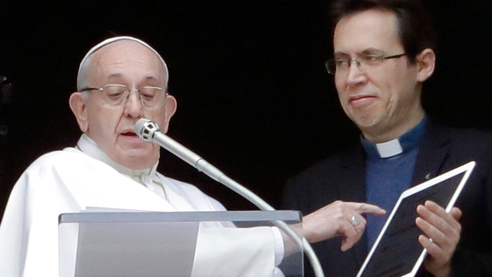 Pope Francis points at a tablet as he unveils his own user profile in Click To Pray, the official app of the Pope's Worldwide Prayer Network, during the Angelus noon prayer he recited from the window of his studio overlooking St. Peter's Square, at the Vatican, Sunday, Jan. 20, 2019. Click To Pray is the official prayer platform for World Youth Day 2019, that Francis will attend in Panama January 22-27, 2019.