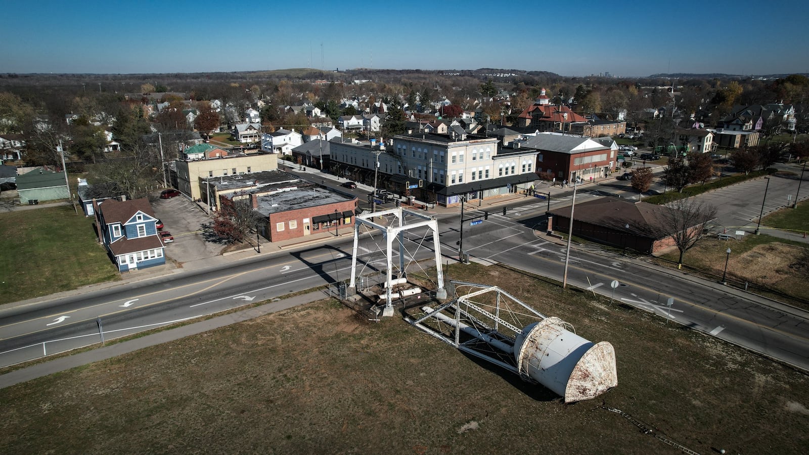 The 1930s-era 100,000-gallon West Carrollton Water Tower at the corner of Elm Street and Central Avenue was taken down Wednesday morning, Nov. 15, 2023. A semi-truck crashed into the tower last week, but the city said it had already planned to raze it. JIM NOELKER/STAFF