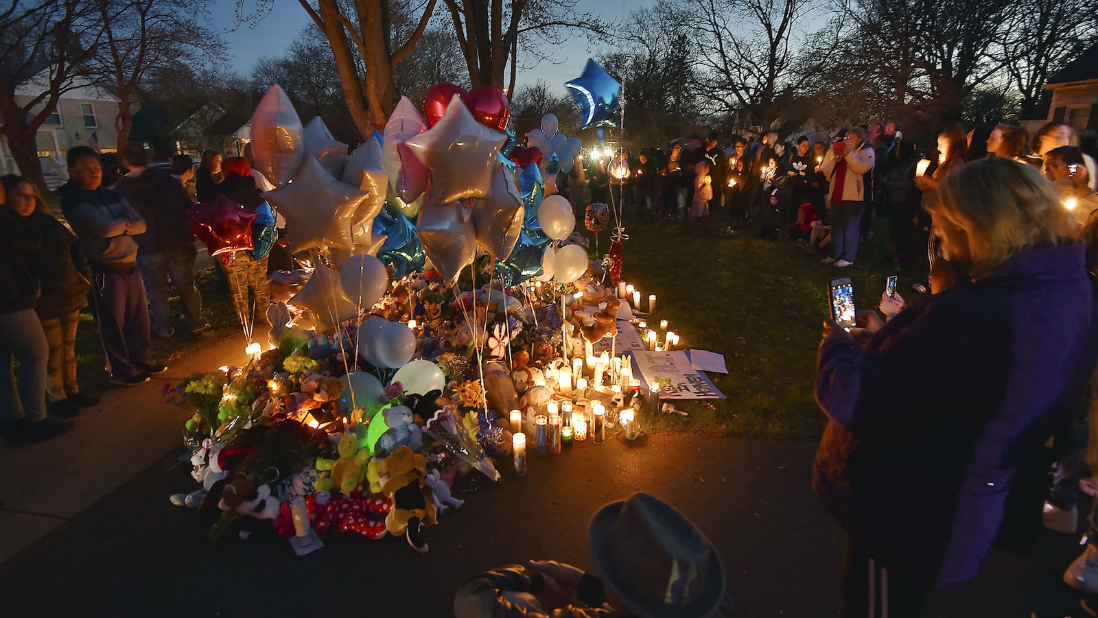 Residents of Crystal Lake, Ill., hold a candlelight vigil April 24, 2019 for Andrew "AJ" Freund Jr., 5, whose body was found buried in a shallow grave earlier that day. AJ was reported missing April 18 by his parents, Andrew Freund Sr., 60, and JoAnn Cunningham, 36, who have been charged with his murder.