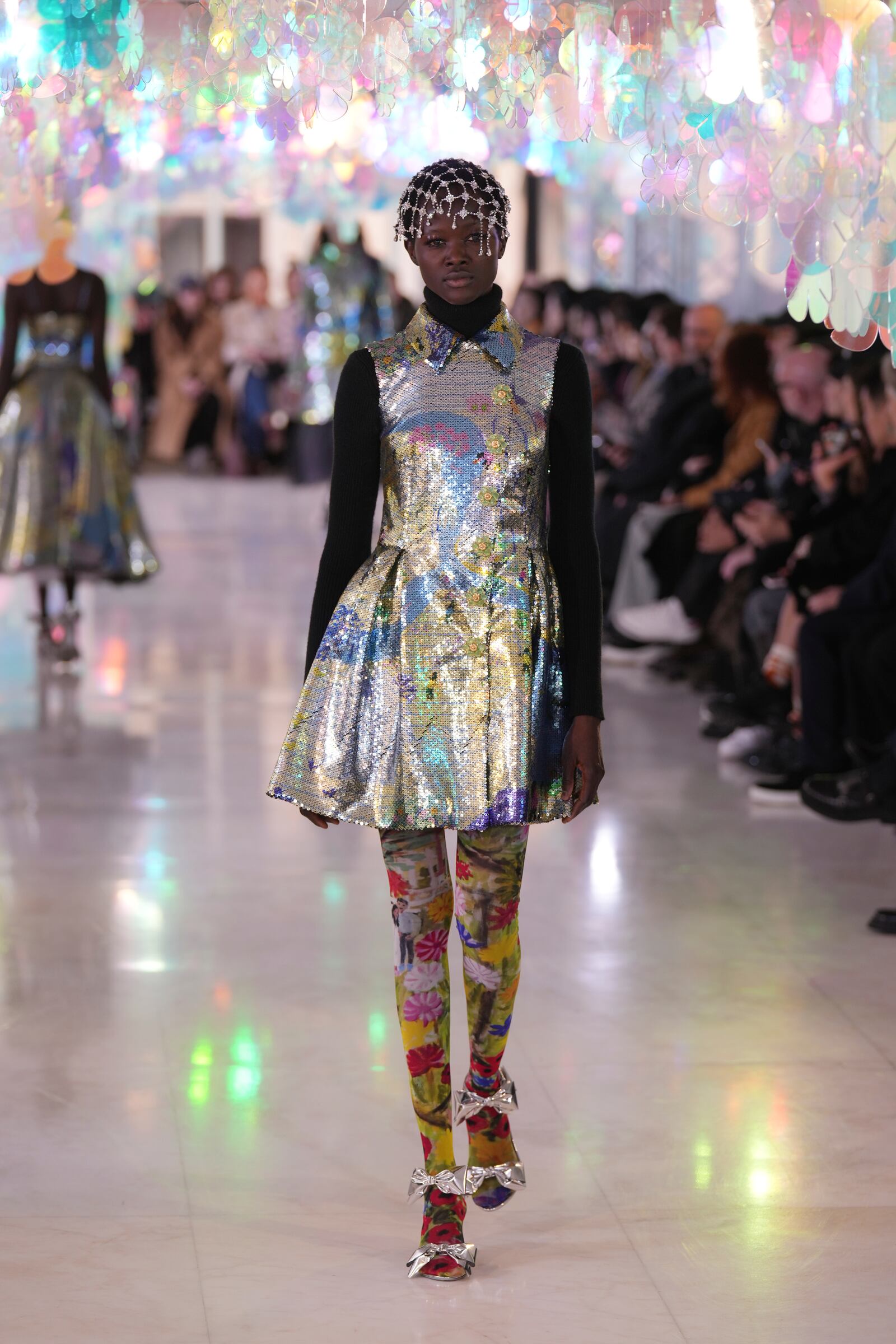 A model wears a creation as part of the Susan Fang Fall/Winter 2025-2026 Women's collection presented in Milan, Italy, Sunday, March 2, 2025. (AP Photo/Antonio Calanni)