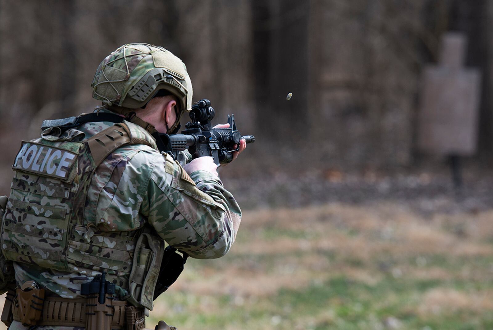 A member of the 88th Security Forces Squadron fires a Simunition round at a fixed target with an M4 carbine rifle during sustainment training at Wright-Patterson Air Force Base on March 17. U.S. AIR FORCE PHOTO/WESLEY FARNSWORTH