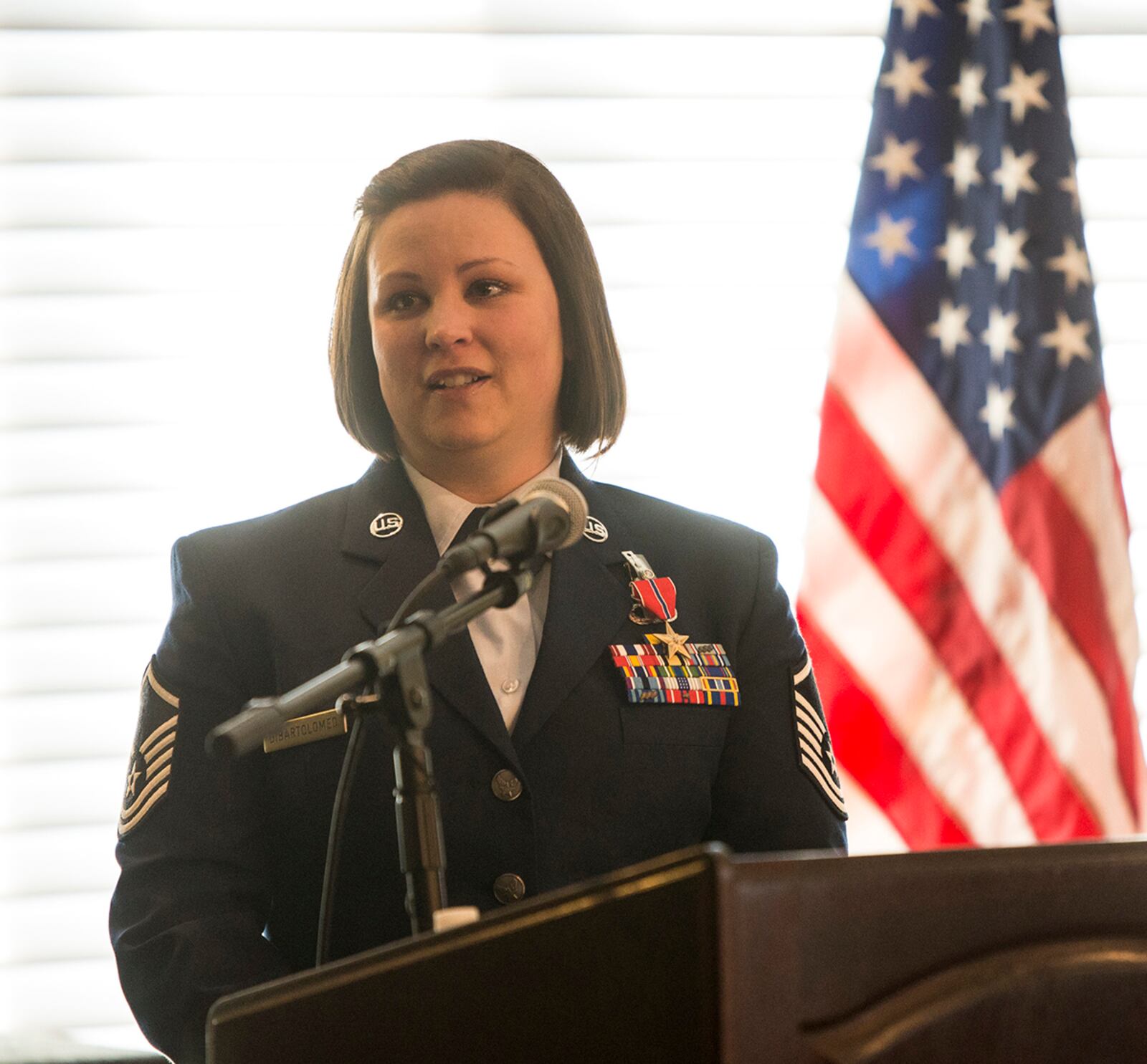 Master Sgt. Wendi DiBartolomeo speaks during a ceremony after being awarded the Bronze Star Medal April 15 at Wright-Patterson Air Force Base. U.S. AIR FORCE PHOTO/JAIMA FOGG